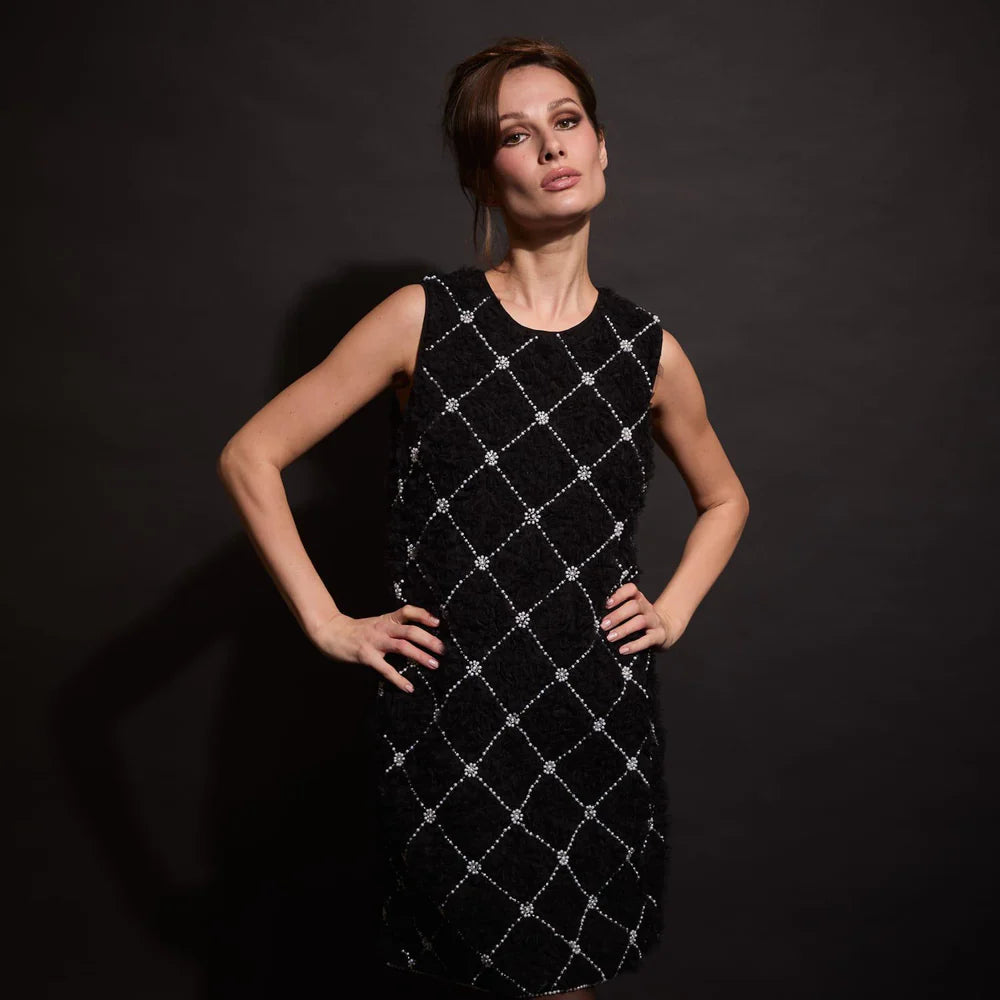 Black textured sleeveless cocktail dress with beaded diamond lattice detail styled for evening