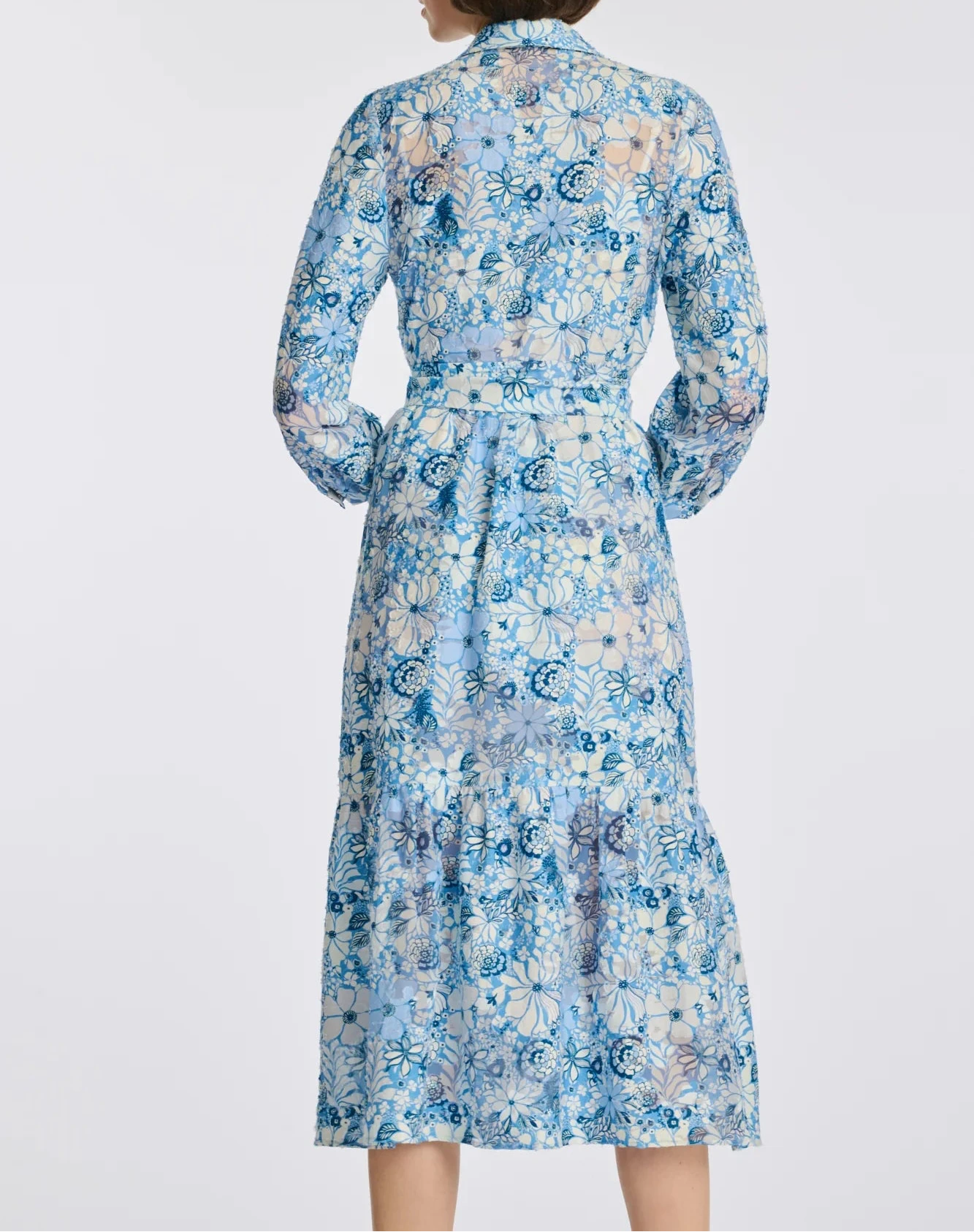 Back view of blue floral midi shirt dress with 3/4 sleeves and calf-length hem