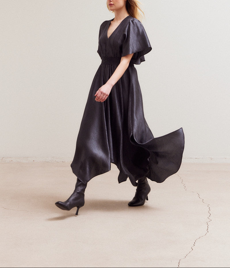 Front angled view of Midnight satin maxi dress with handkerchief hem