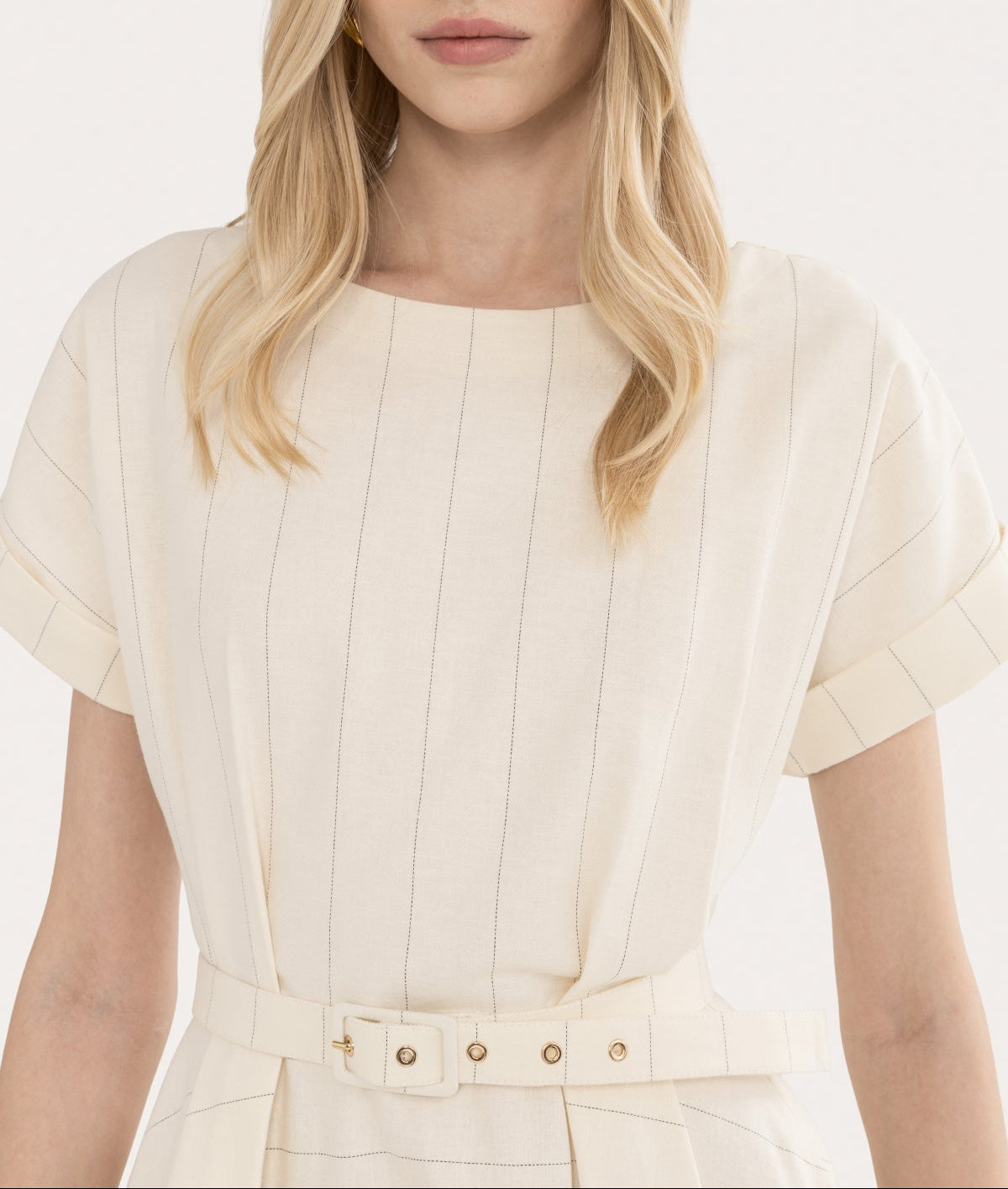Close-up of the upper bodice and neckline on an ivory striped midi day dress