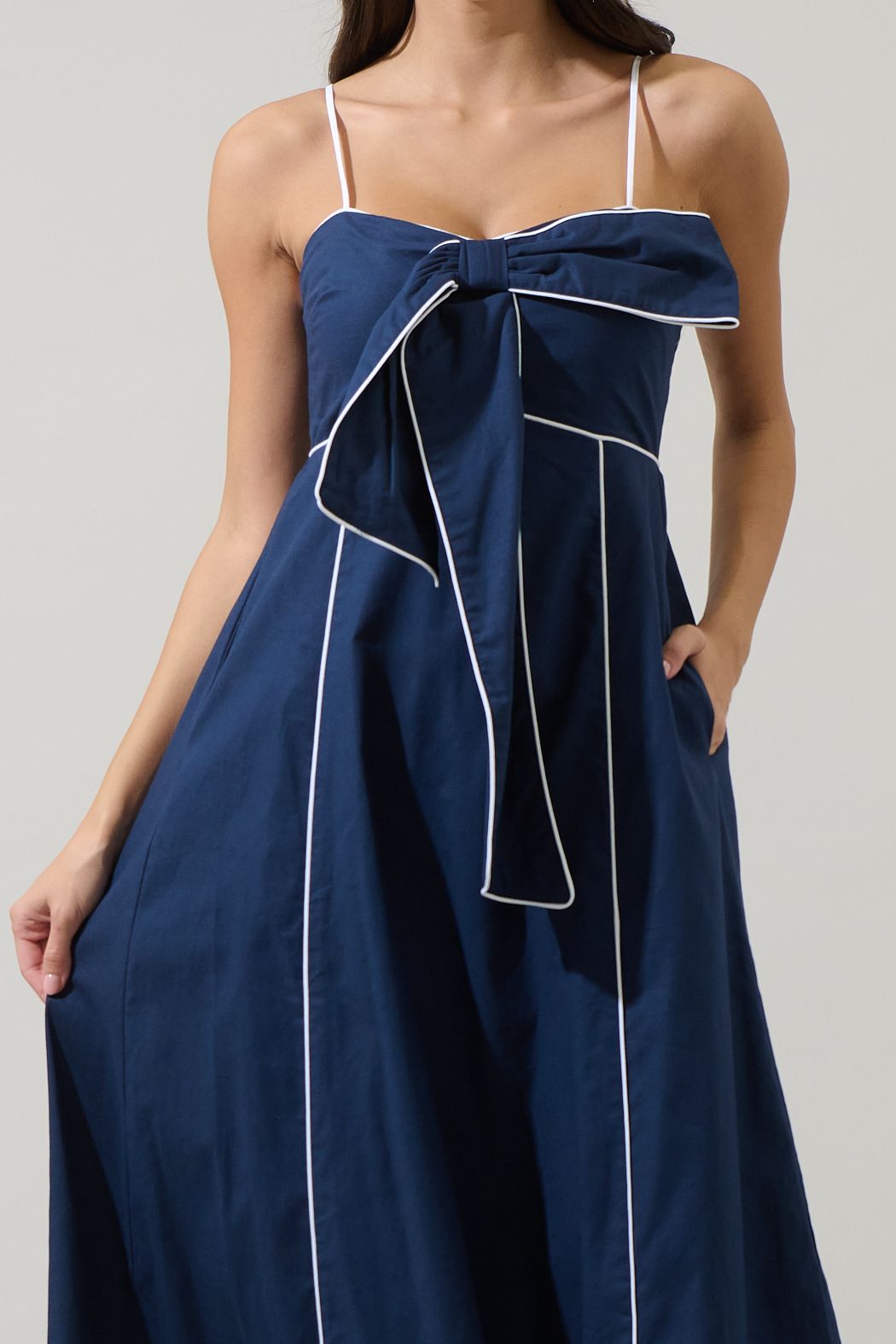 Sugarlips Viona navy and white bow-front midi dress with contrast piping, sweetheart neckline and empire waist.