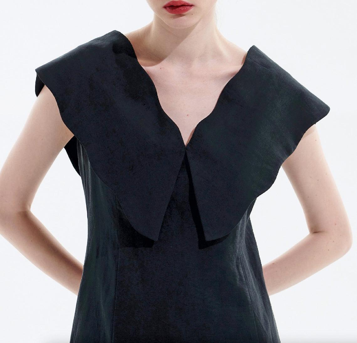 Close-up of oversized collar on black Tencel linen dress