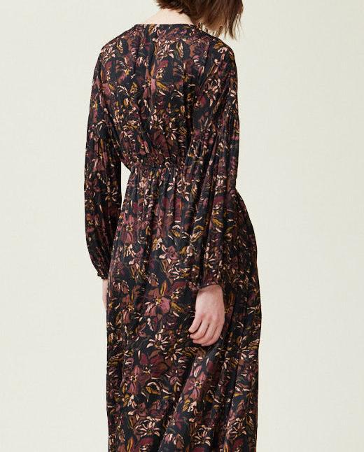 Back angled detail view of black floral satin midi dress with gathered waist