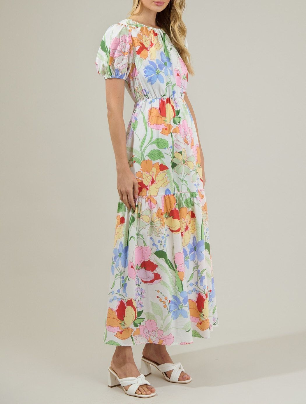 Side view of pastel floral puff sleeve maxi dress with tiered skirt