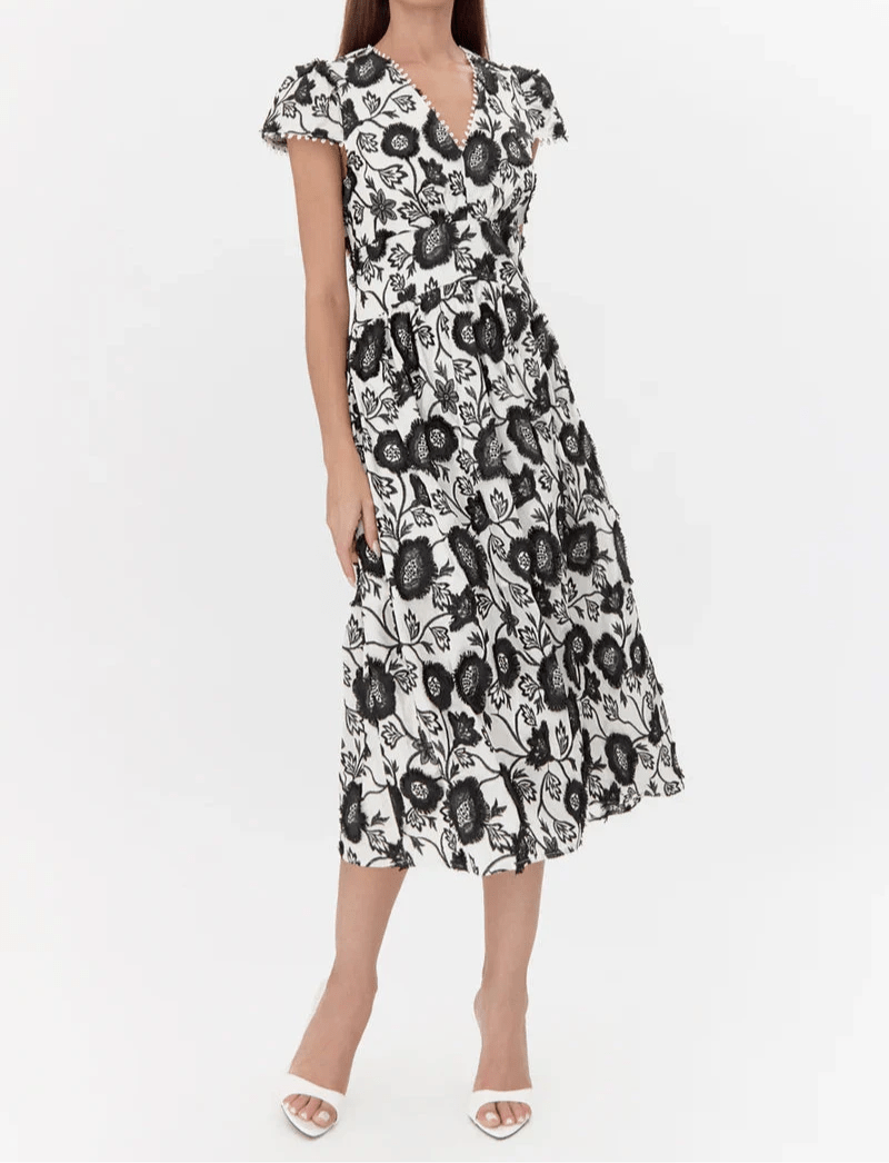 Black and ivory floral embroidered midi dress with V-neckline and short puff sleeves