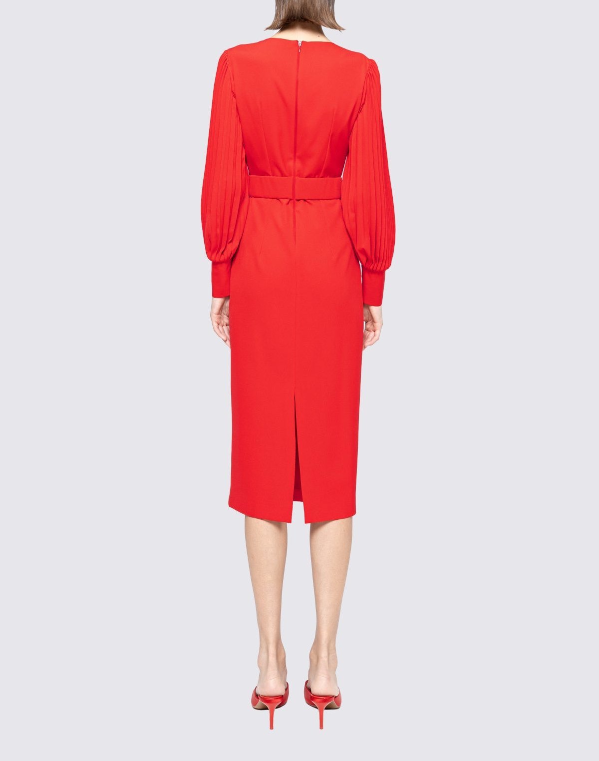 Back view of red belted midi sheath featuring back vent and concealed zip