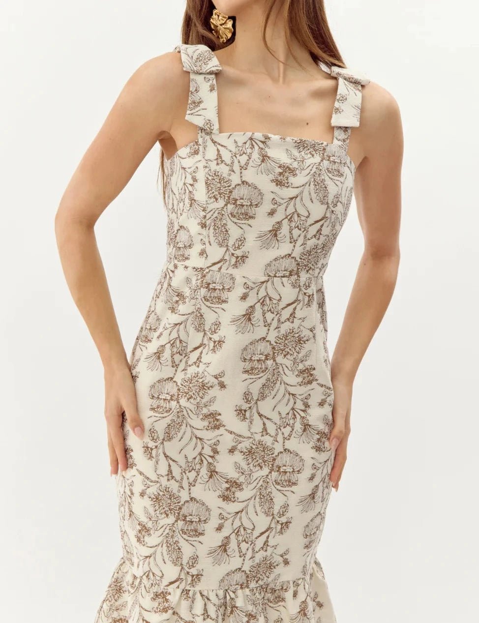 Close-up front view of cream mocha floral jacquard midi dress showing square neckline and bow-detail shoulder straps