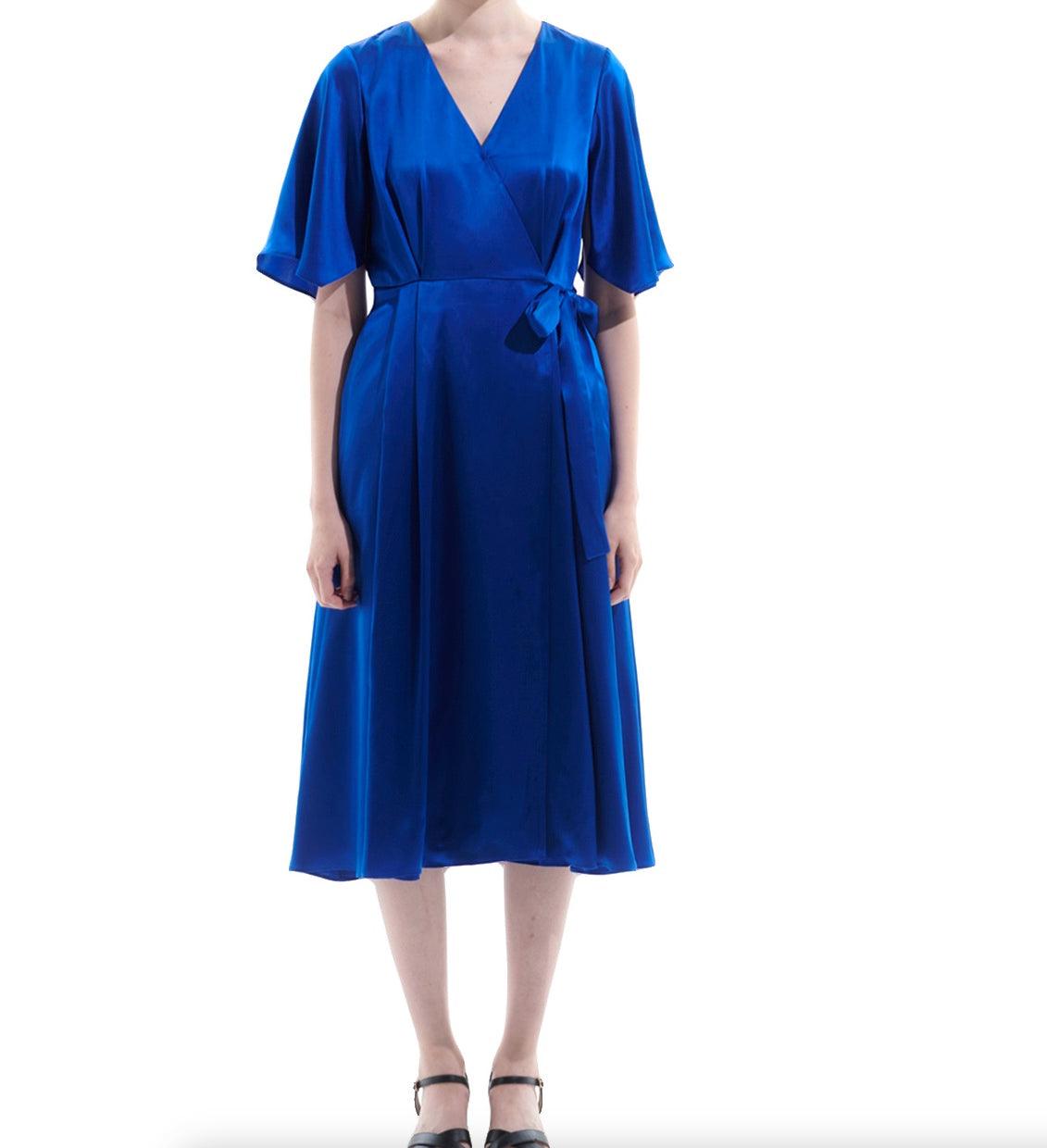 Close-up of adjustable waist tie on royal blue silk wrap dress for customizable fit
