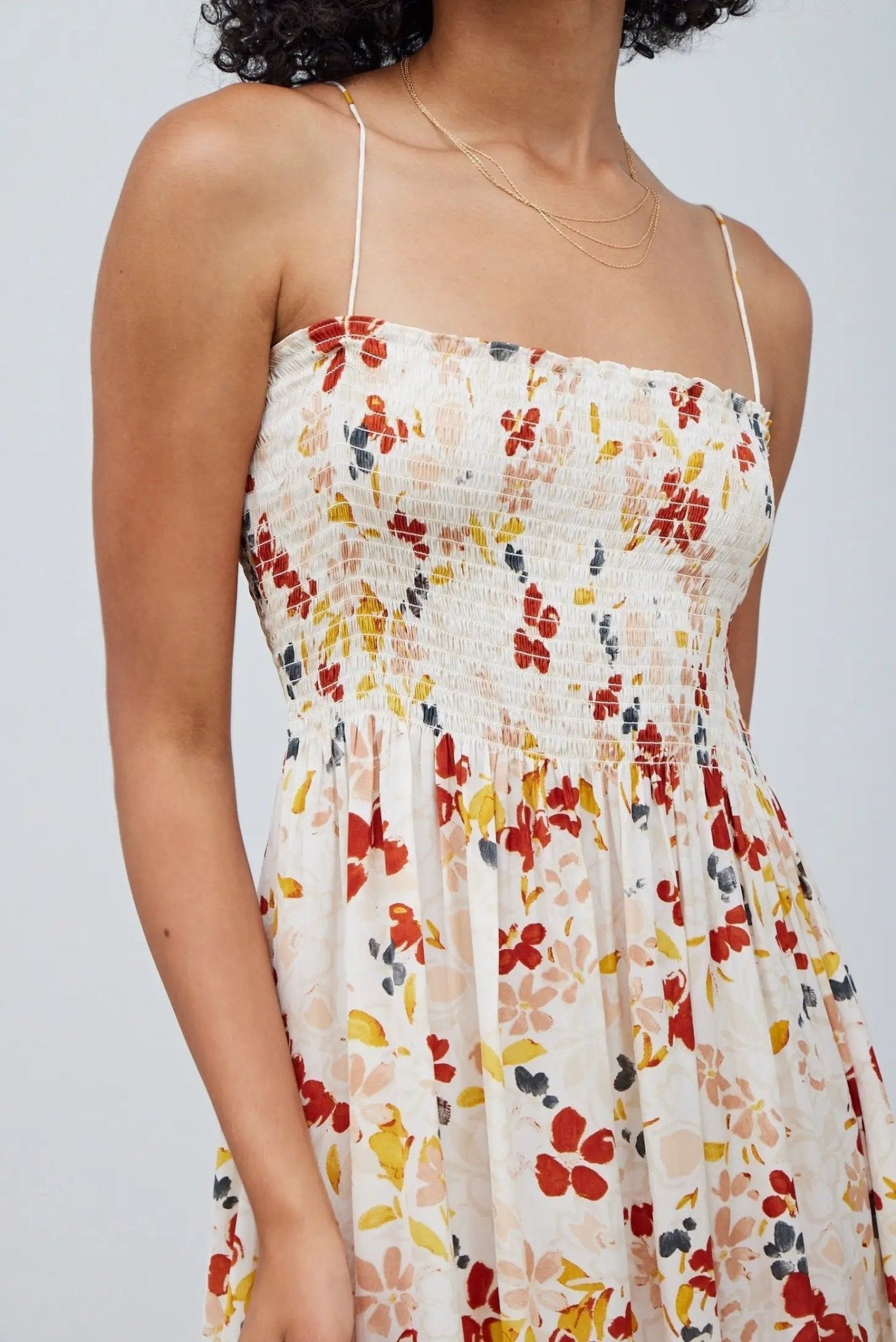 Cream floral satin midi dress by Grade & Gather with smocked bodice, pockets, and multicolor floral print