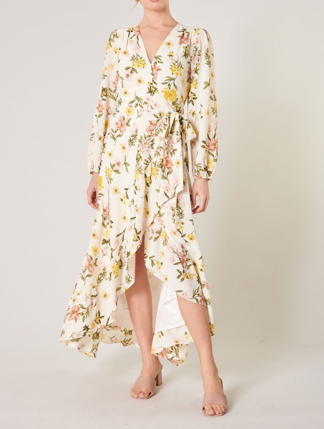 Pastel floral wrap maxi dress with long sleeves and asymmetrical ruffle hem front view
