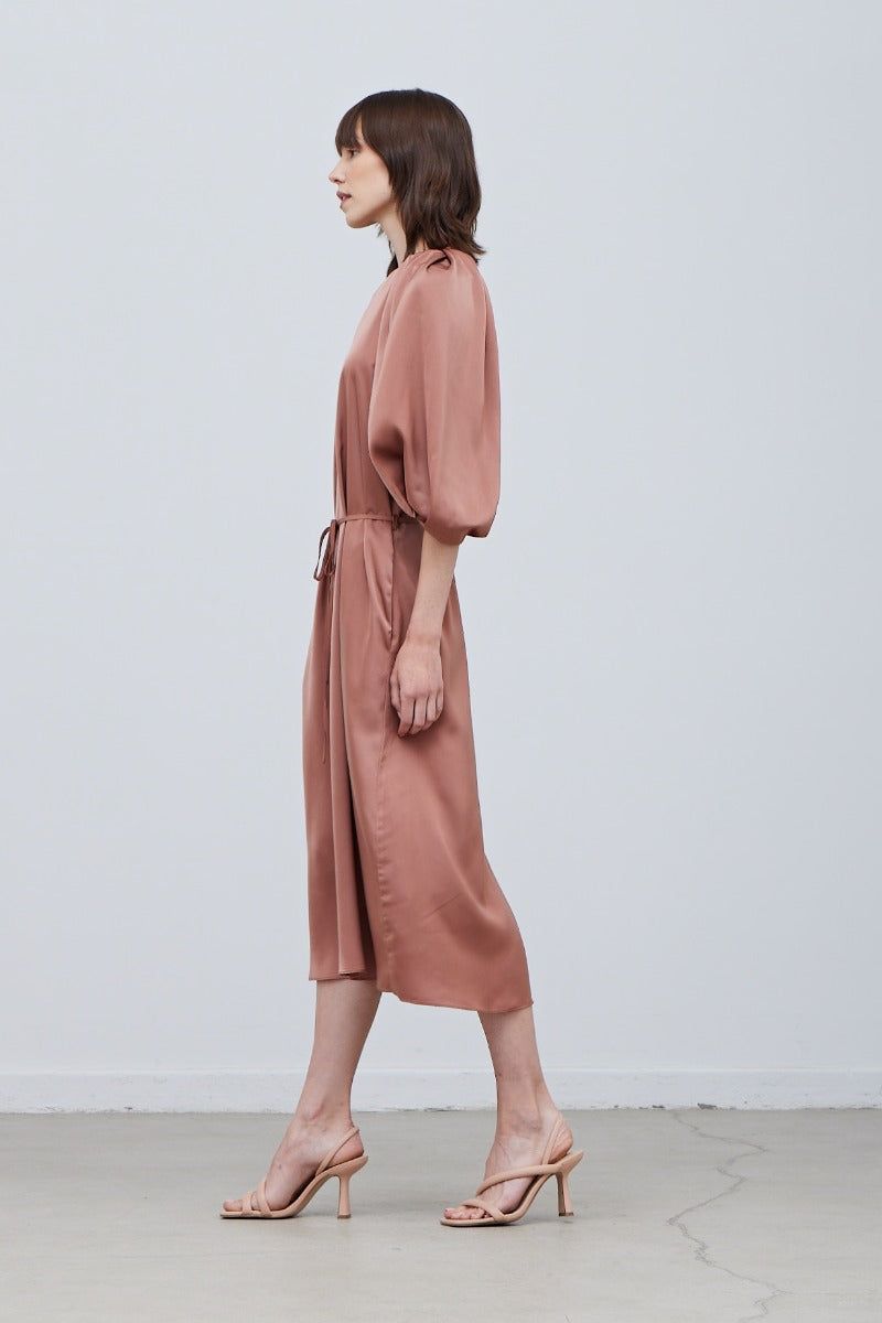 Side view of Rose Tan satin 3/4 sleeve midi dress with gathered neckline