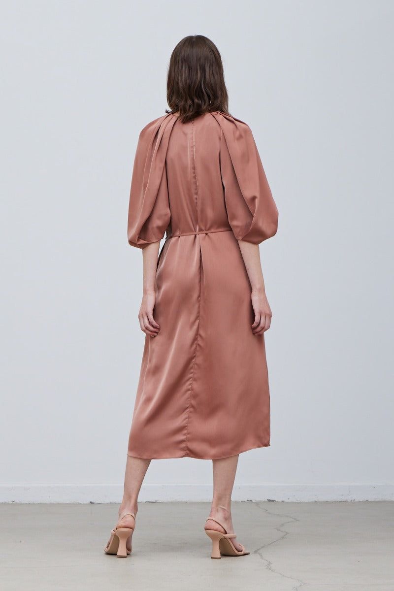 Back view of Rose Tan satin midi dress with blouson sleeves and midi length