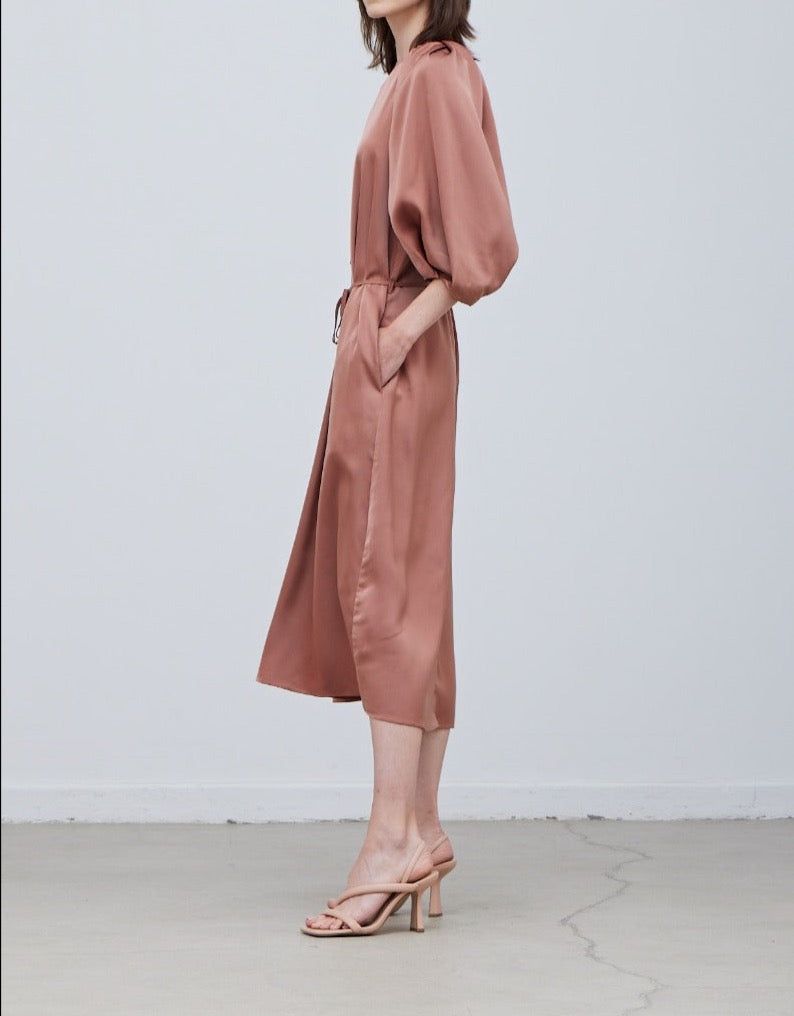 Rear side view of Rose Tan satin midi dress with waist tie and relaxed silhouette