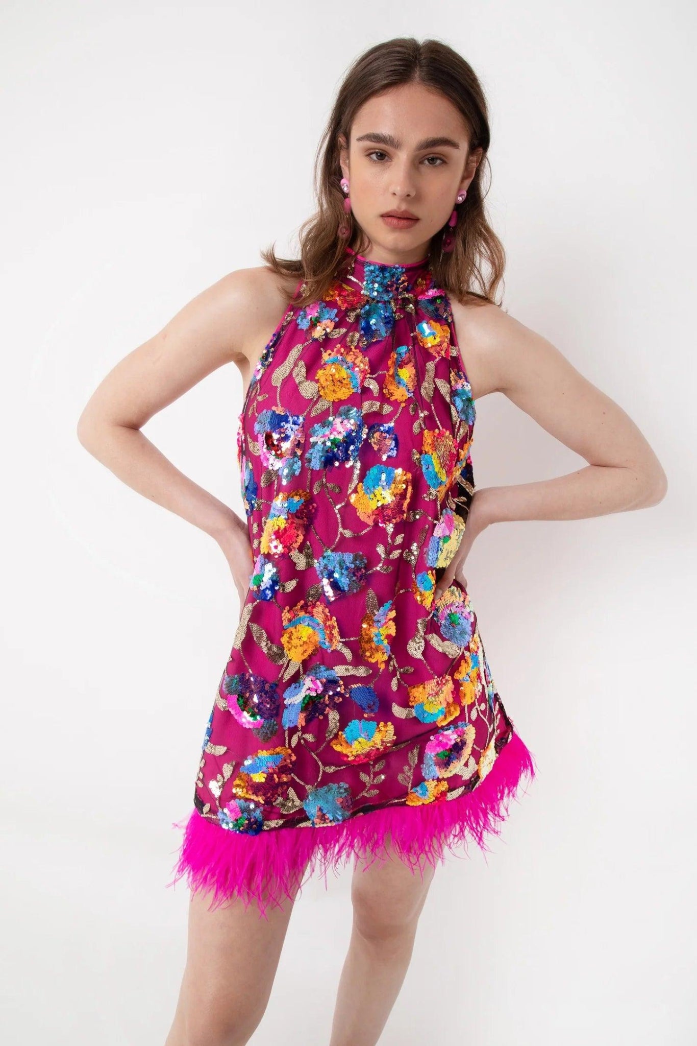 Statement pink sequin mini dress with floral embellishment and feather trim