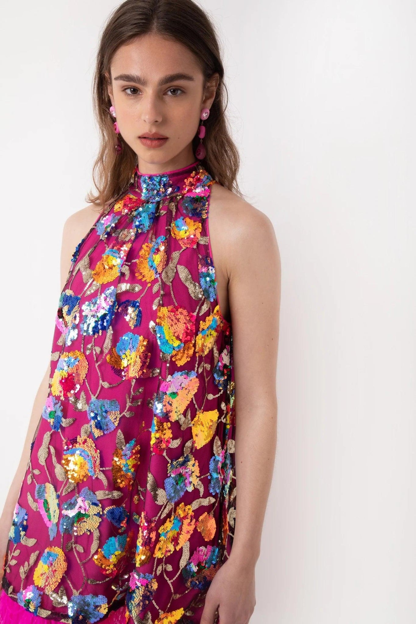 Close view Women’s pink feather trim cocktail mini dress with floral sequins