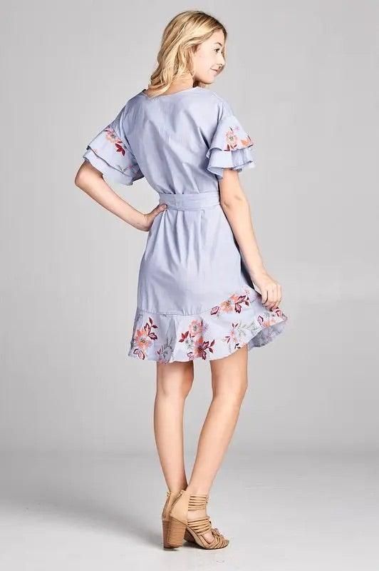 FModel wearing Renee C light blue floral embroidery dress with ruffles