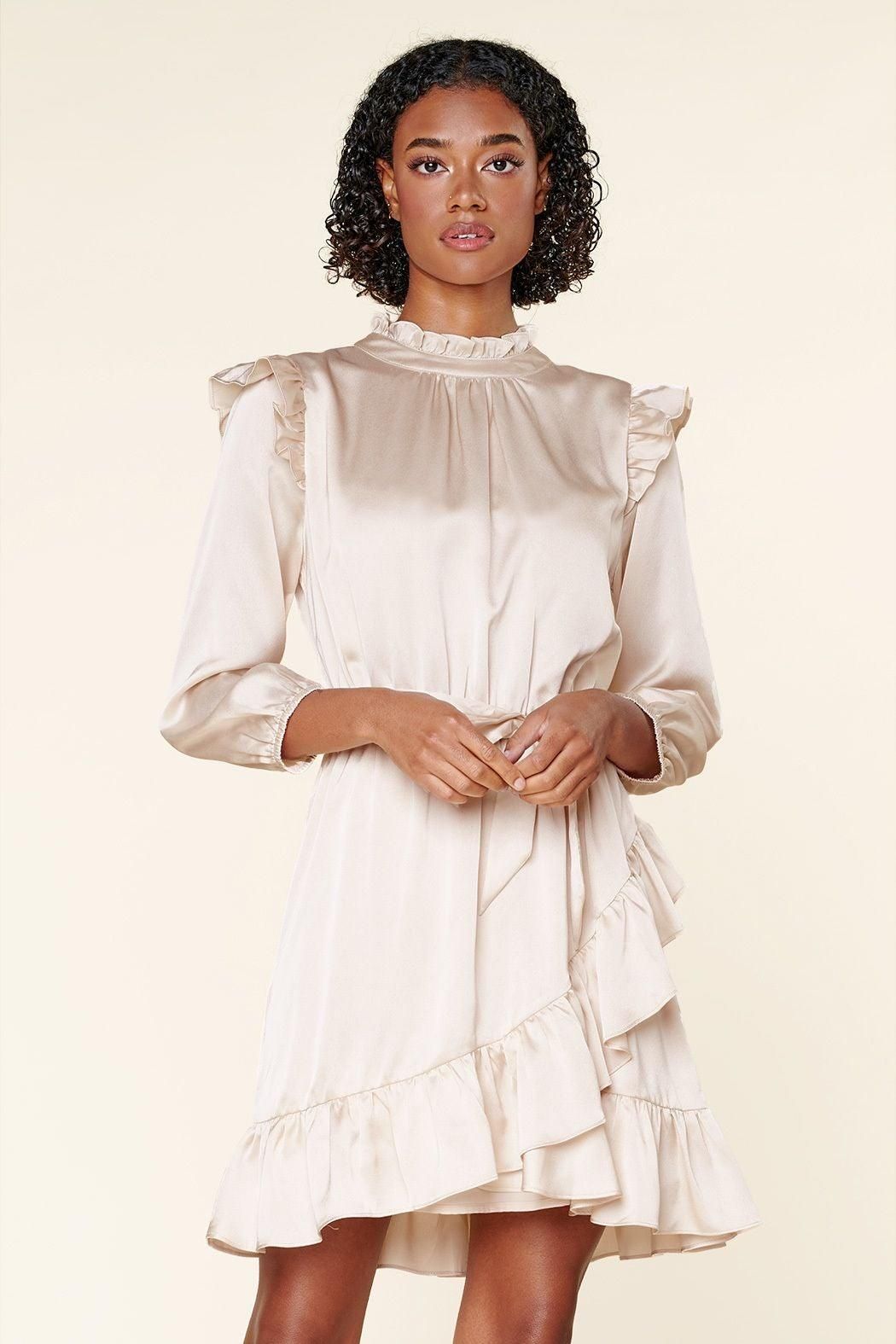 Champagne cocktail mini dress with high neckline and feminine flared silhouette