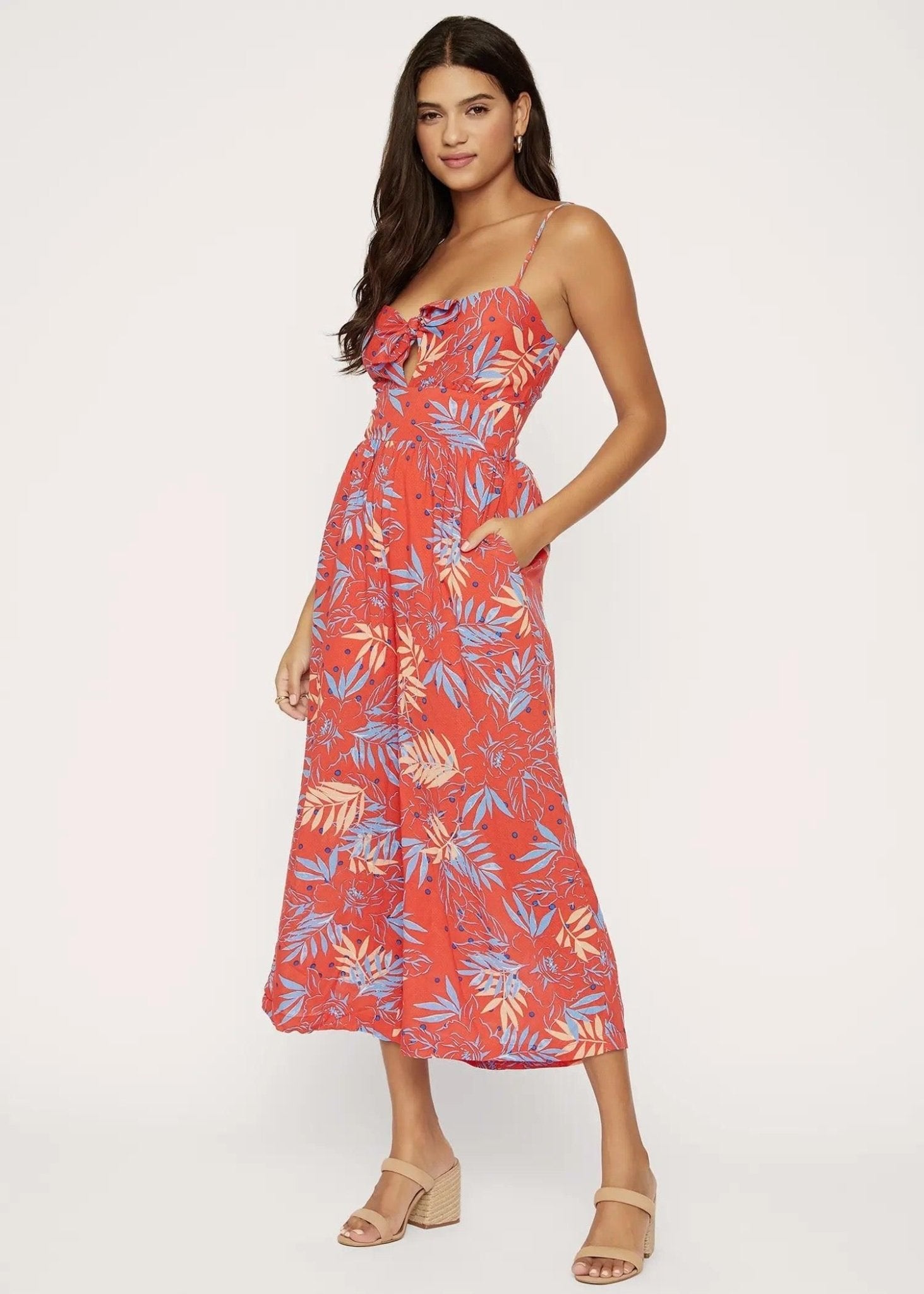 Angled view of Lost + Wander wine multicolor jumpsuit with wide-leg silhouette