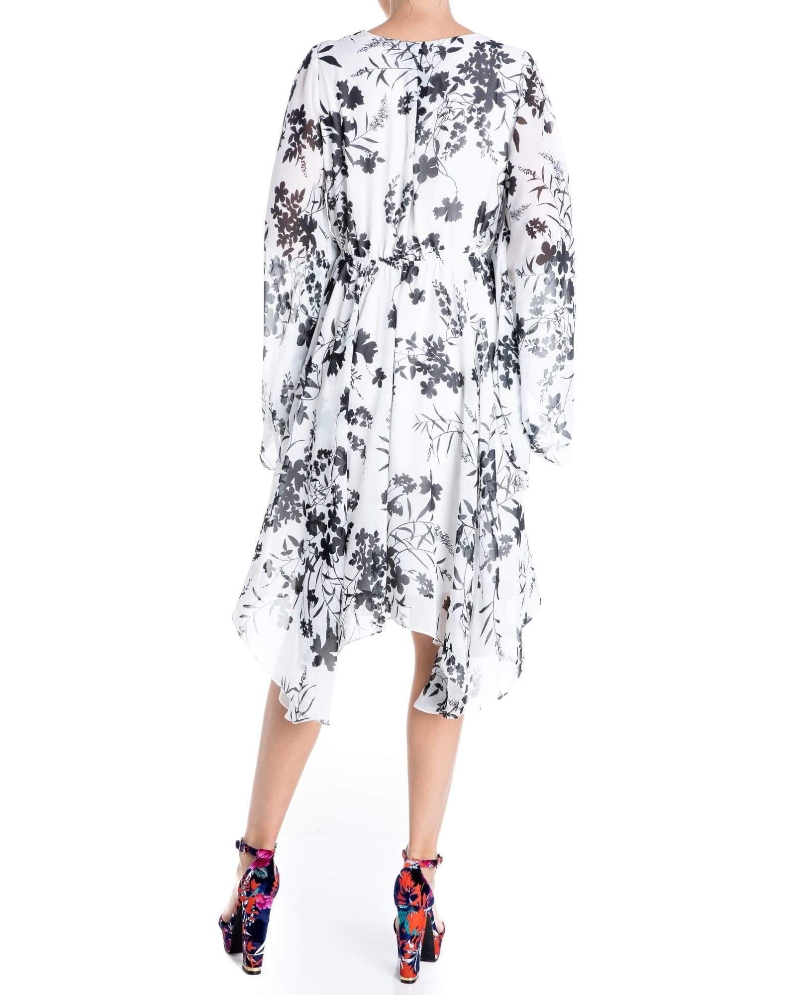 Back view of Meghan LA Sunset Dress with long kimono sleeves and soft floral burnout print
Close-up of Dahlia White burnout floral chiffon print on Meghan LA Sunset Dress