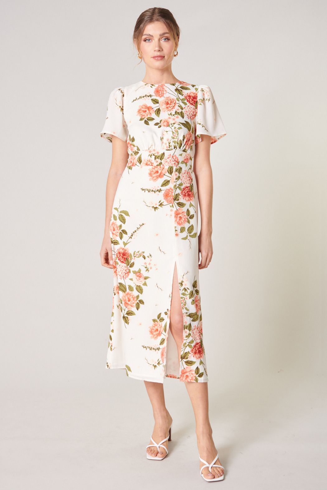 Ivory floral flutter sleeve midi dress with smocked waist and front slit front view