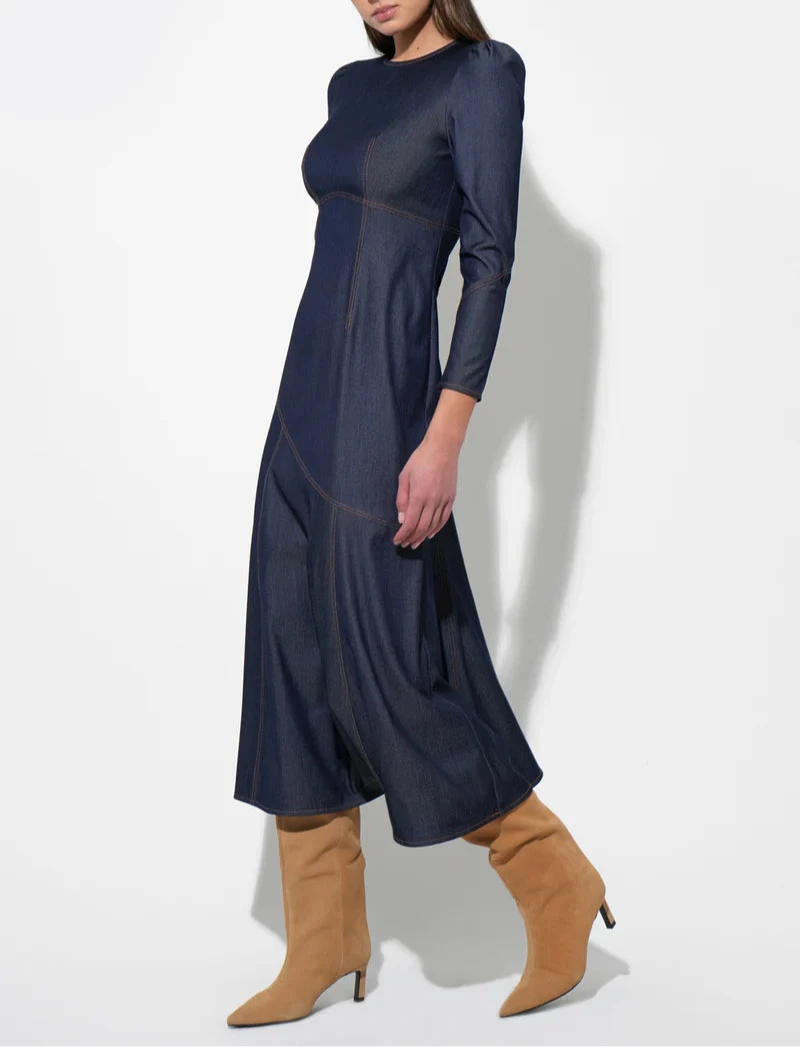 Side view of dark denim midi dress with sleeves and contrast stitching