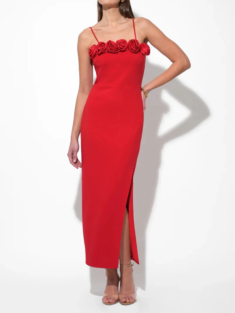 Side angle of scarlet red rosette midi dress with front slit