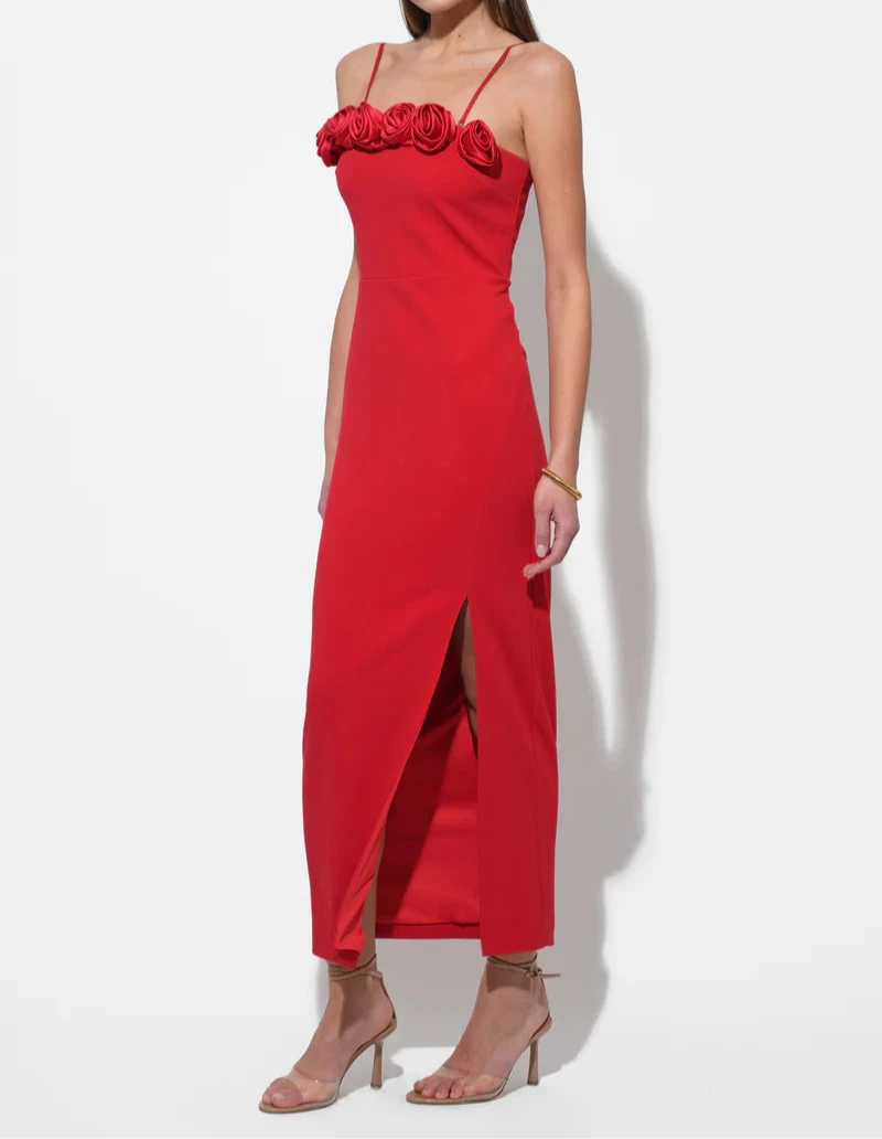 Side angle of scarlet red rosette midi dress with front slit