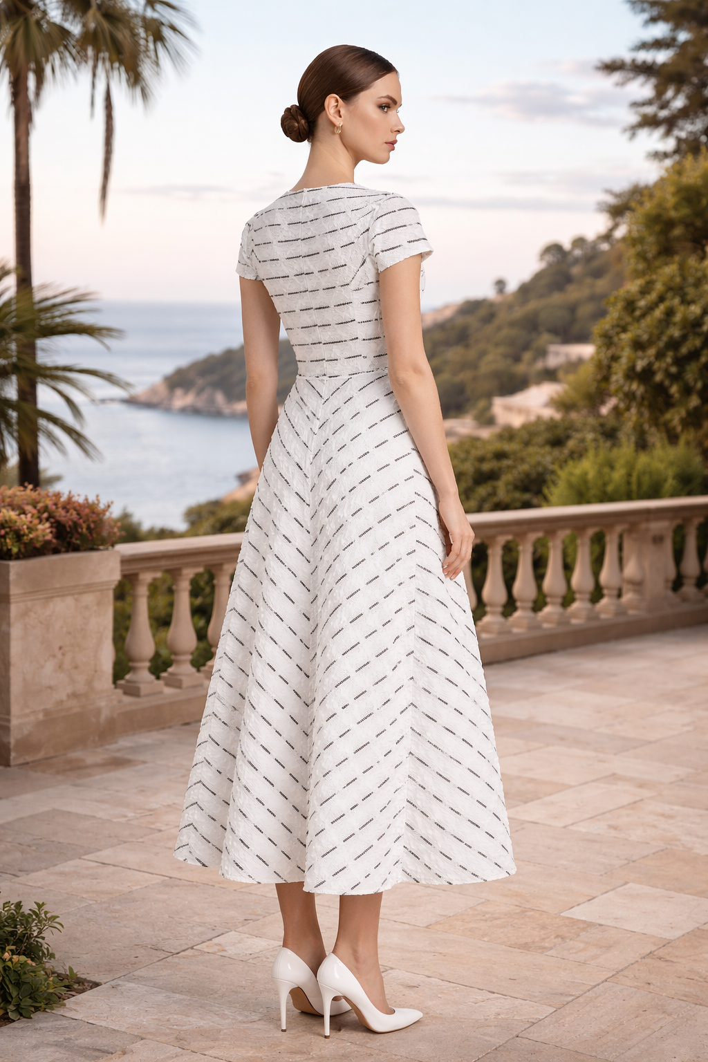 Elegant black and white lace midi dress styled for wedding guest and cocktail occasions