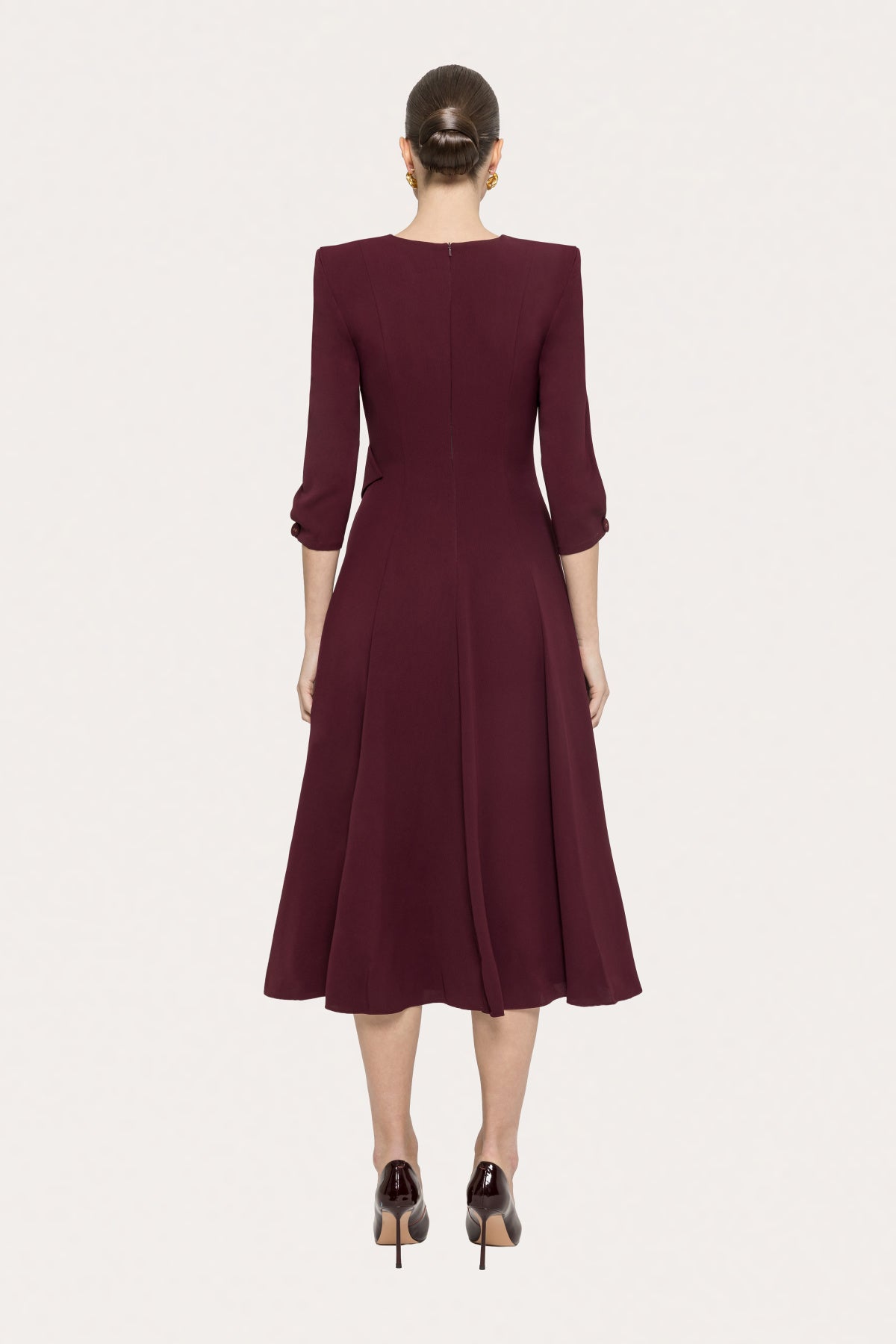 Back view of NISSA bordeaux A-line midi dress with center back zipper and flared midi skirt