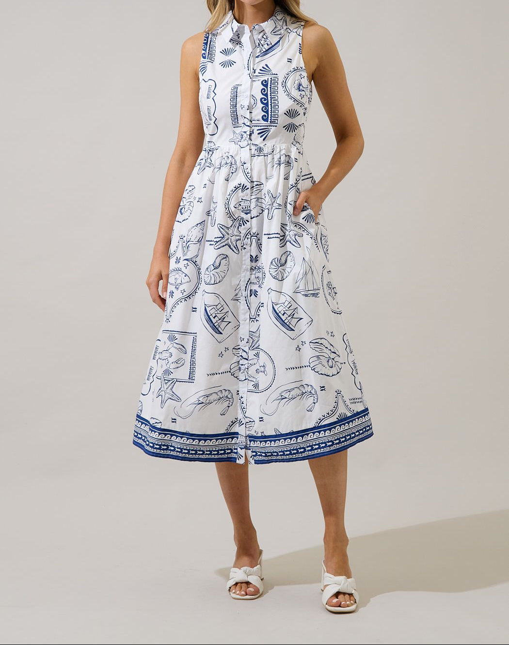 Blue and white seaside print sleeveless collared midi shirtdress front view