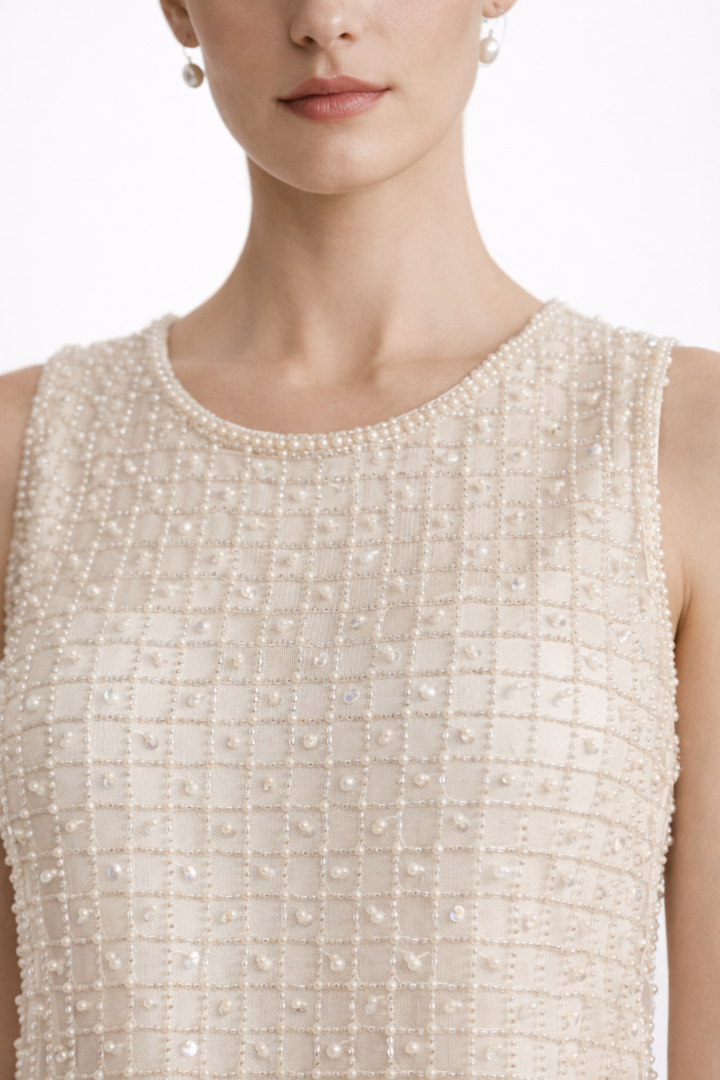 Cream pearl-embellished sleeveless shift dress with round neckline detail