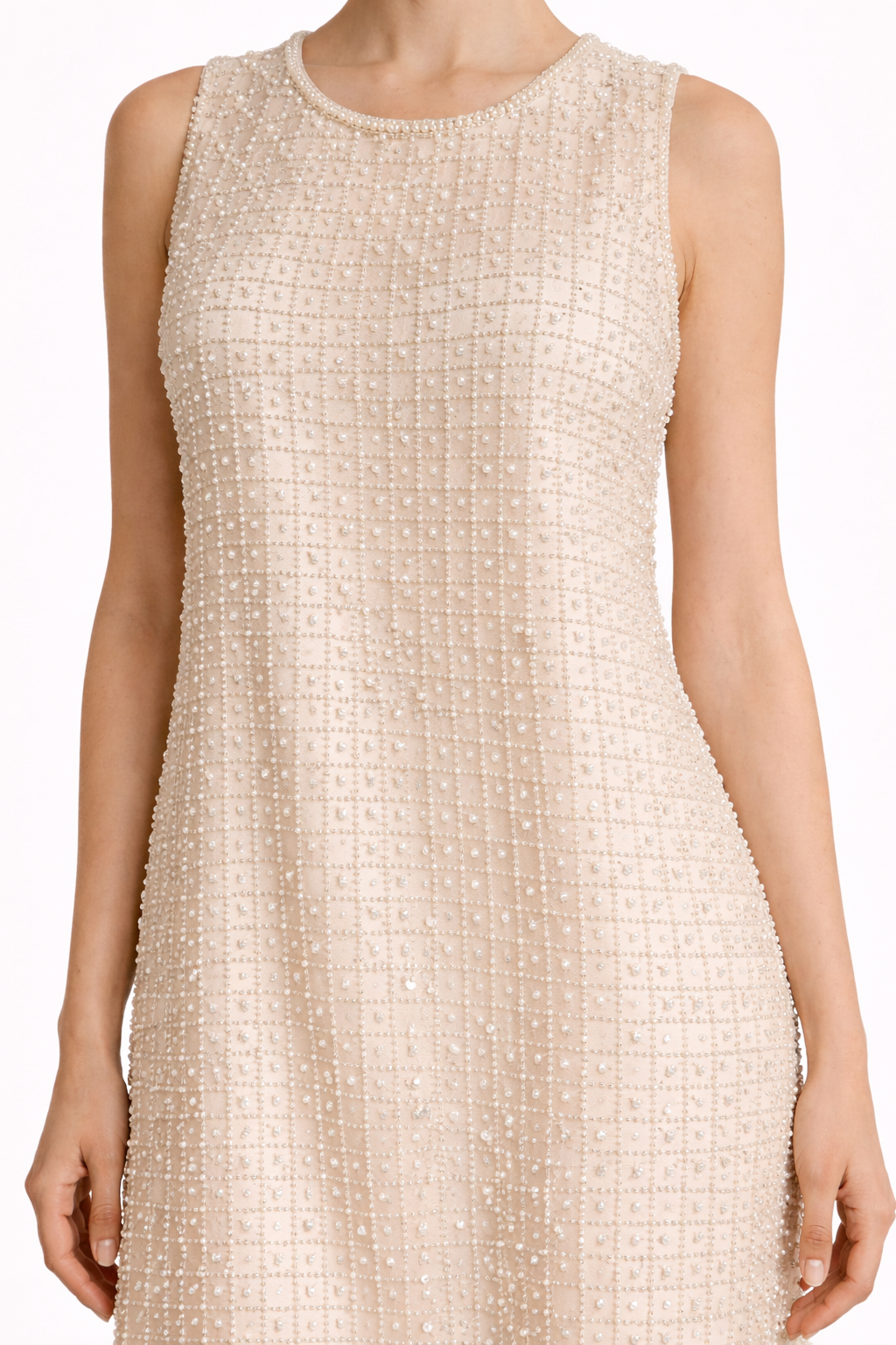 Close-up of pearl bead and sequin grid embellishment on cream mesh dress