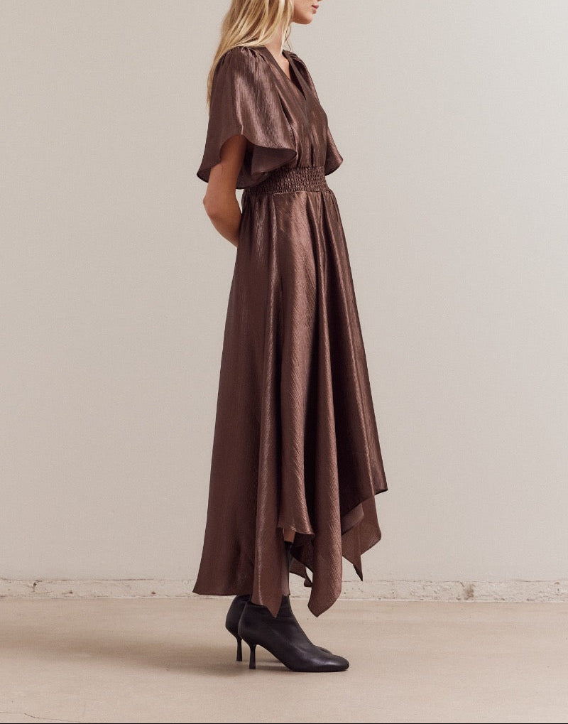 side view of dark chocolate flutter sleeve satin maxi dress with smocked waist