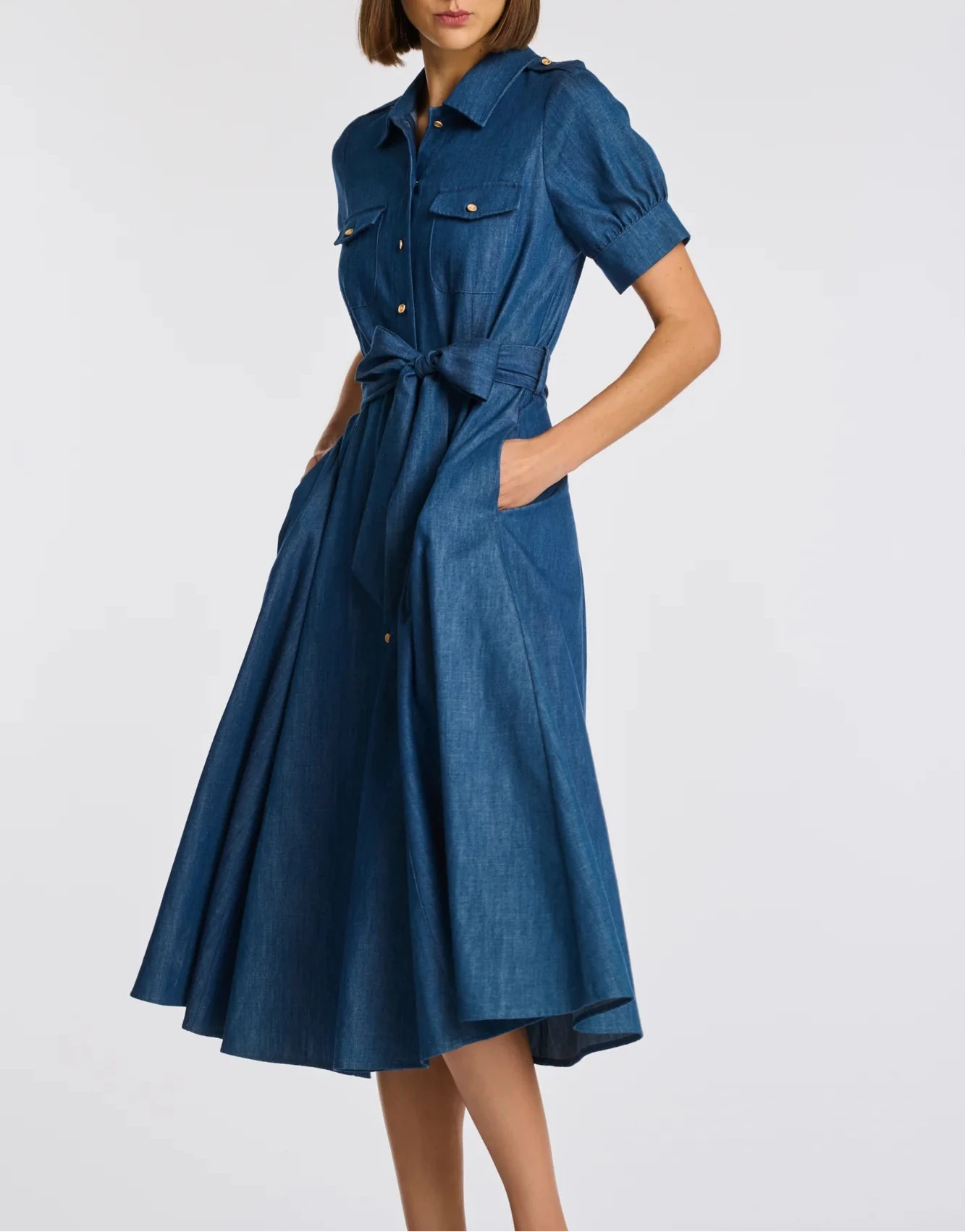 Blue denim midi shirt dress with tie waist, side pockets, and short cuffed sleeves