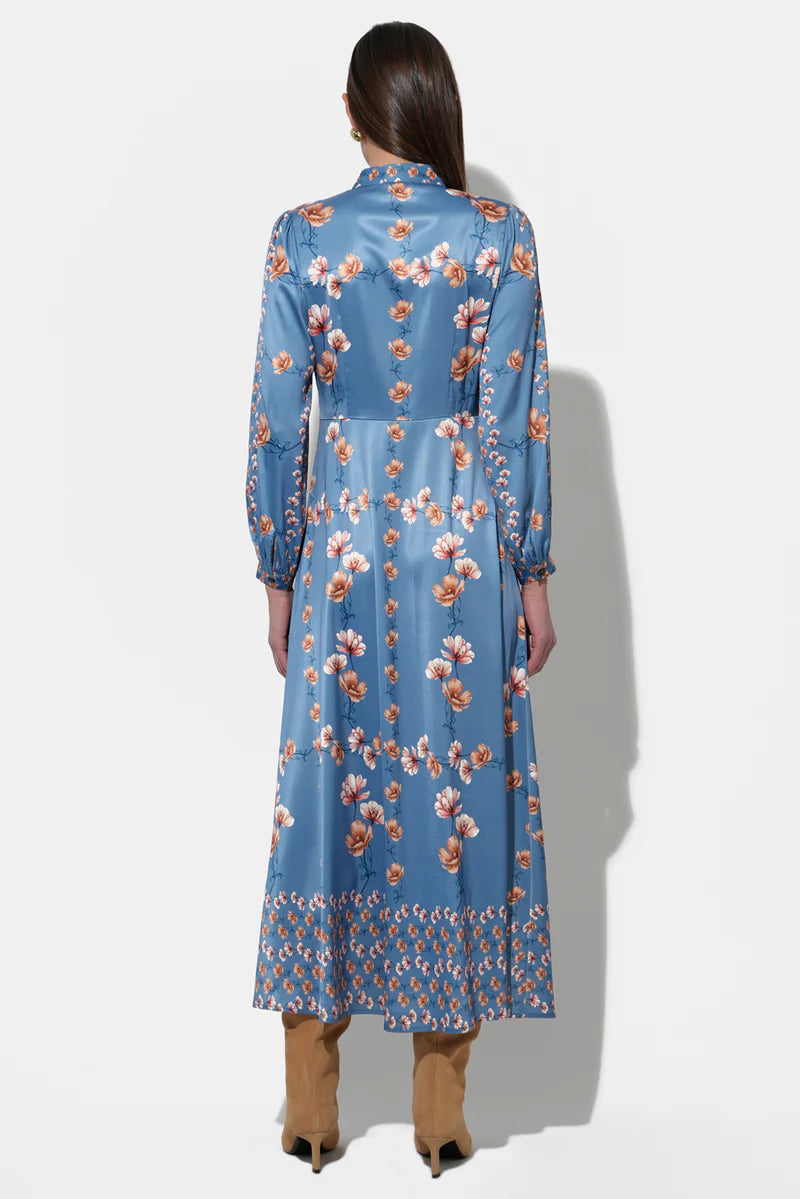 Back view of blue floral long sleeve midi dress by Adelyn Rae