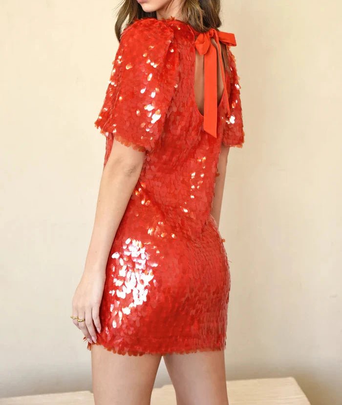 Red sequin mini dress with bow tie keyhole back by Adelyn Rae