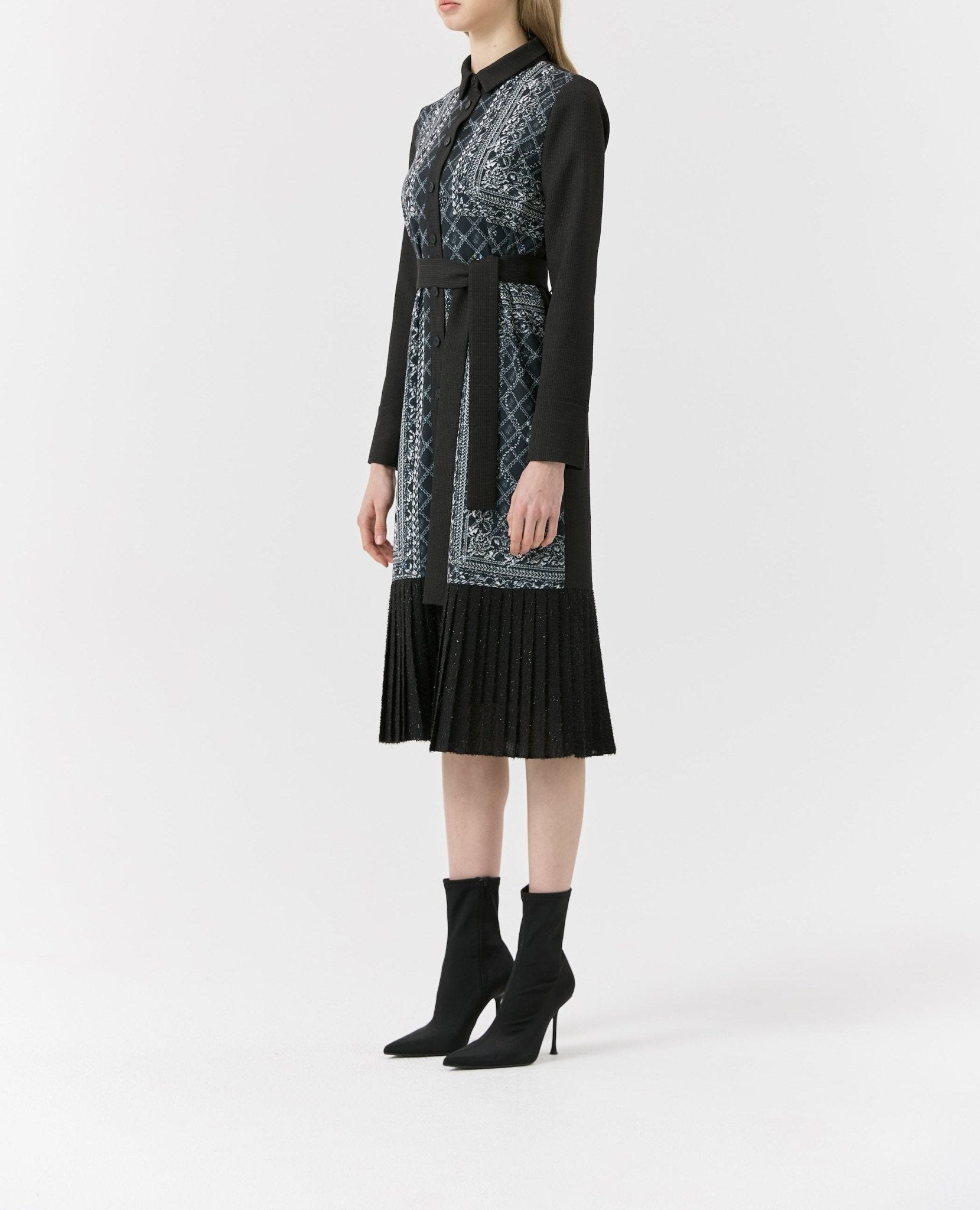 Side view of long-sleeve collared midi dress showing tie belt and pleated skirt