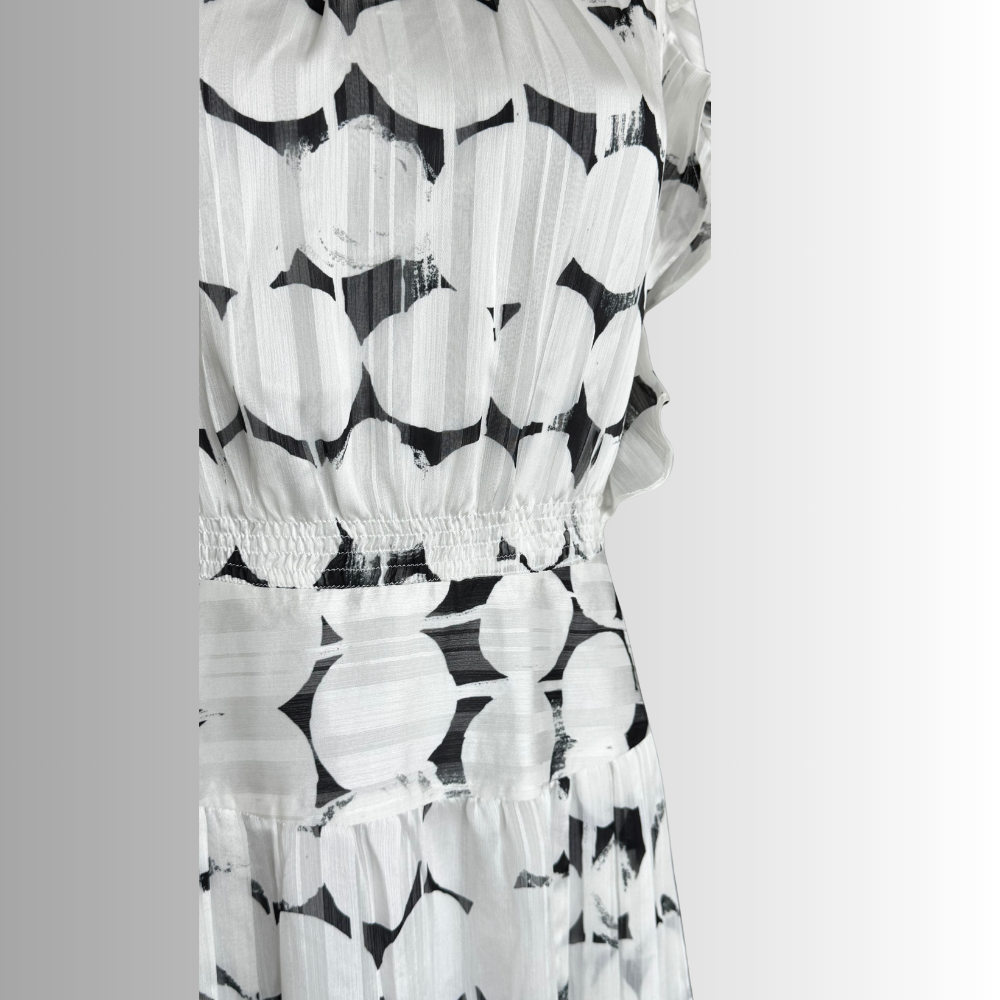 Close-up of elastic waist and wide waistband on monochrome Nora Noh midi dress