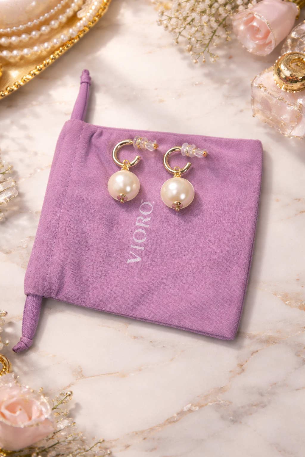 VIOROO pearl drop hoop earrings on top of branded VIOROO pouch