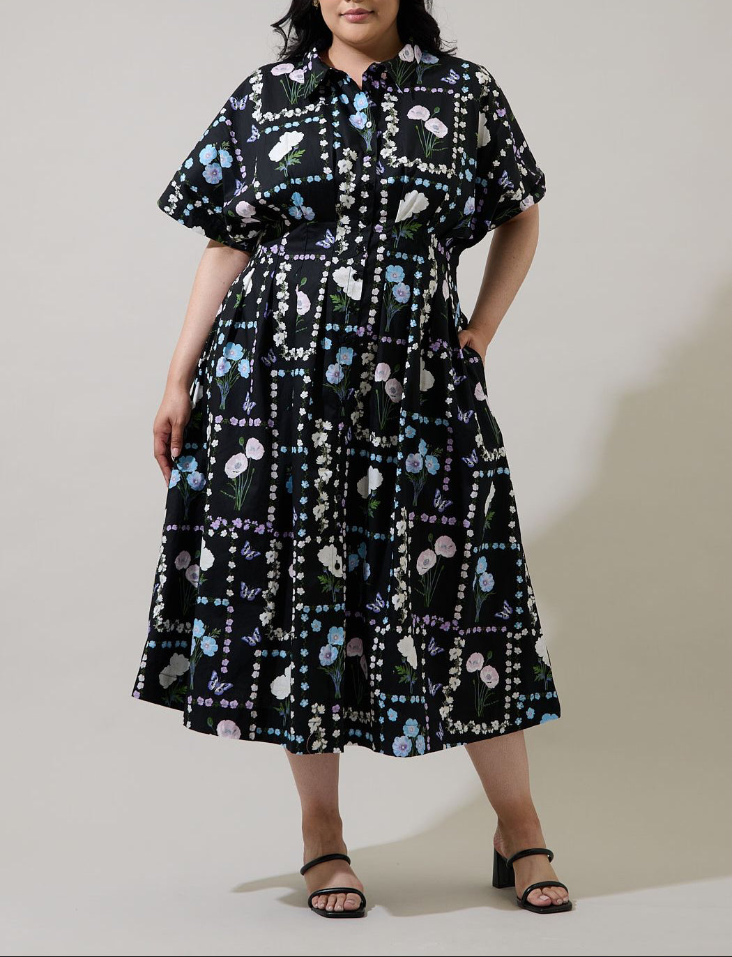 Curve fit front view of Wilderra Trevis Floral midi shirt dress with smocked waist and pockets