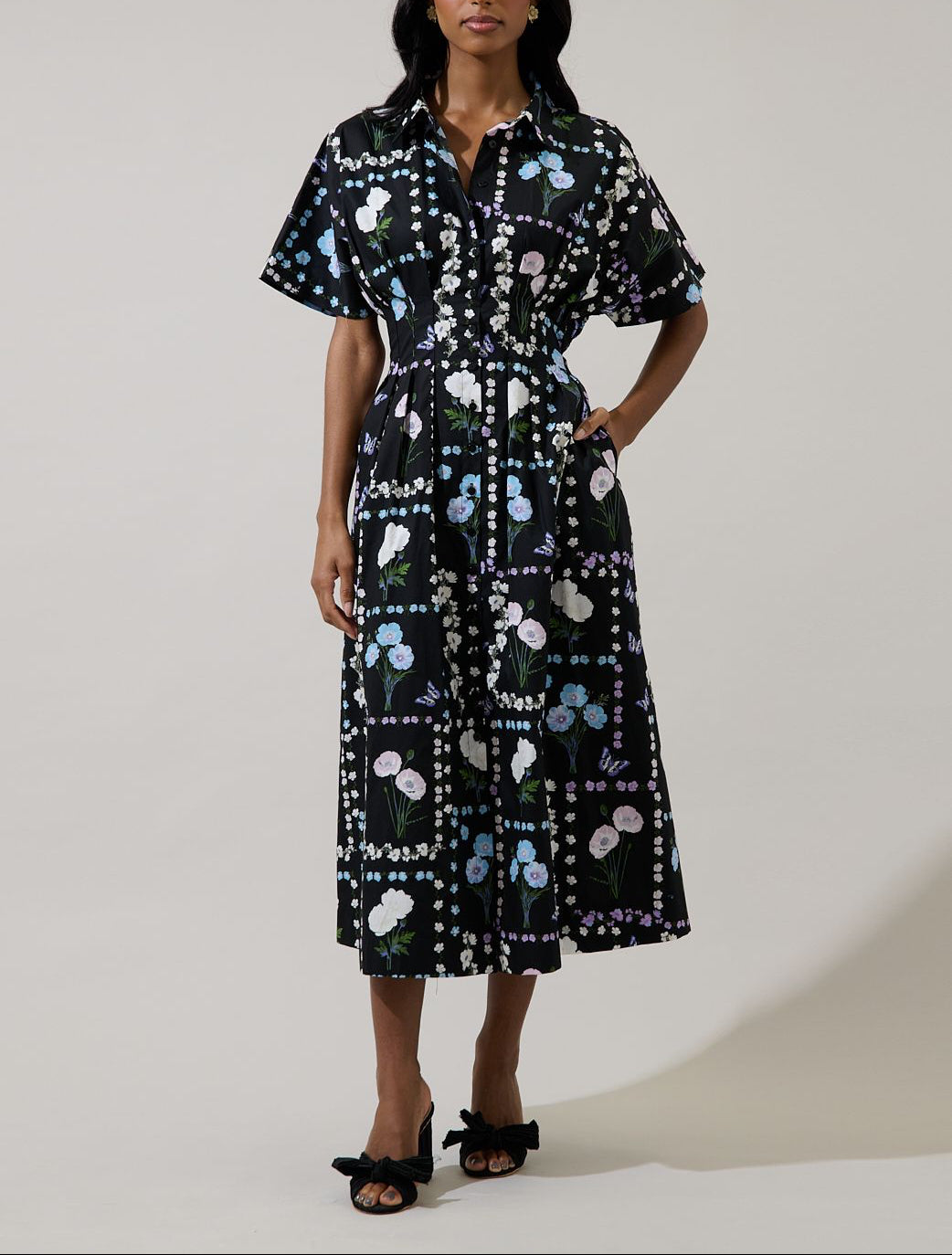 Front view of Wilderra Trevis Floral cotton midi dress with smocked waist, collar and pockets