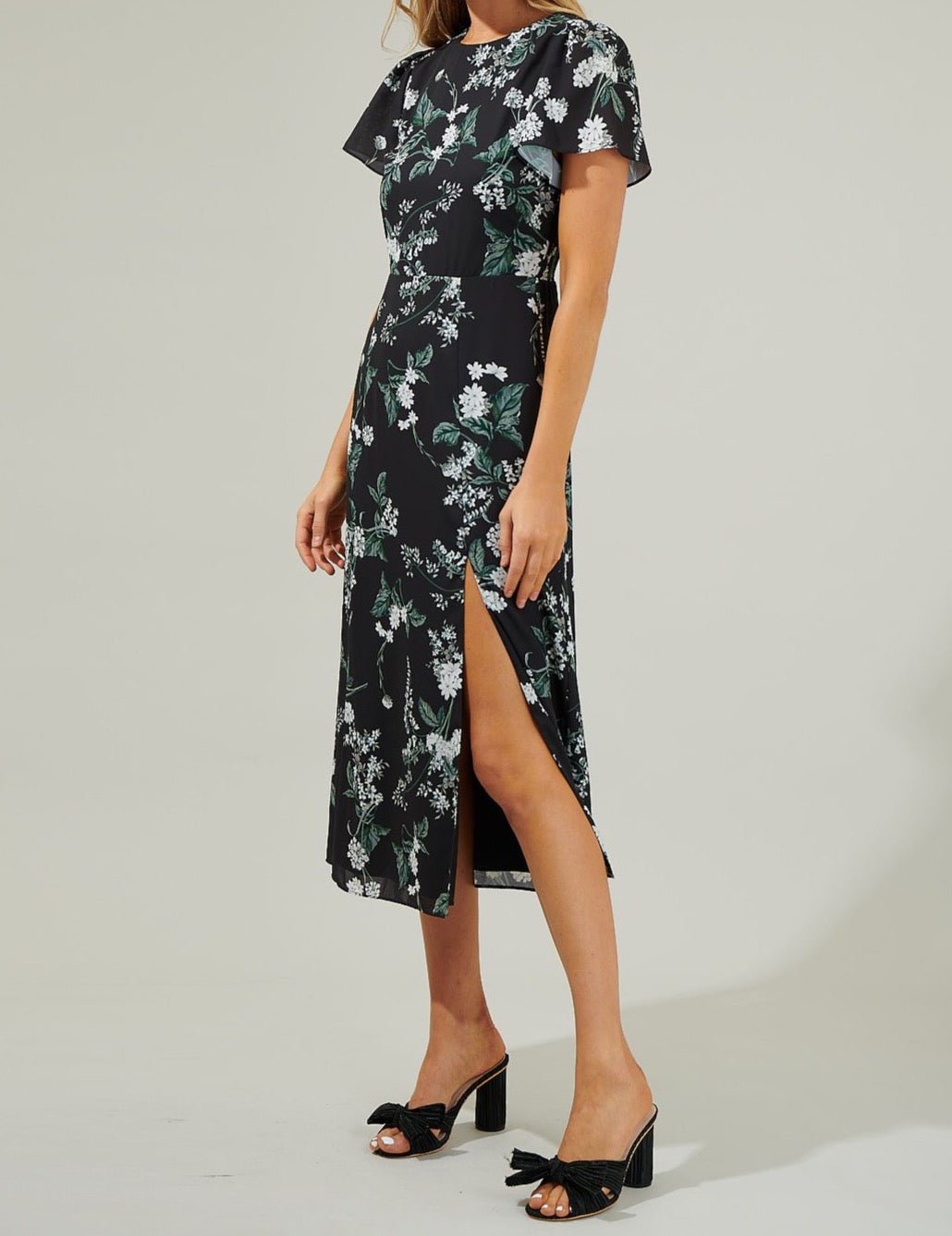 Black floral midi dress with flutter sleeves and high side slit side view