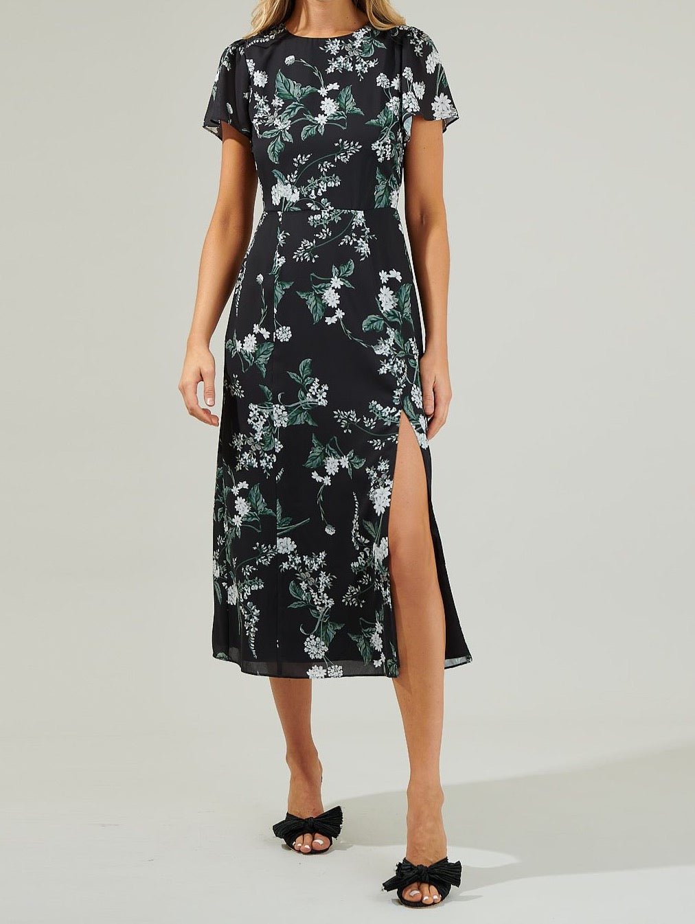 Black floral slit midi dress with flutter sleeves and round neckline front view