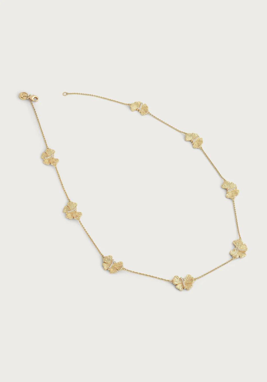 18K gold butterfly station necklace laid flat showing station design