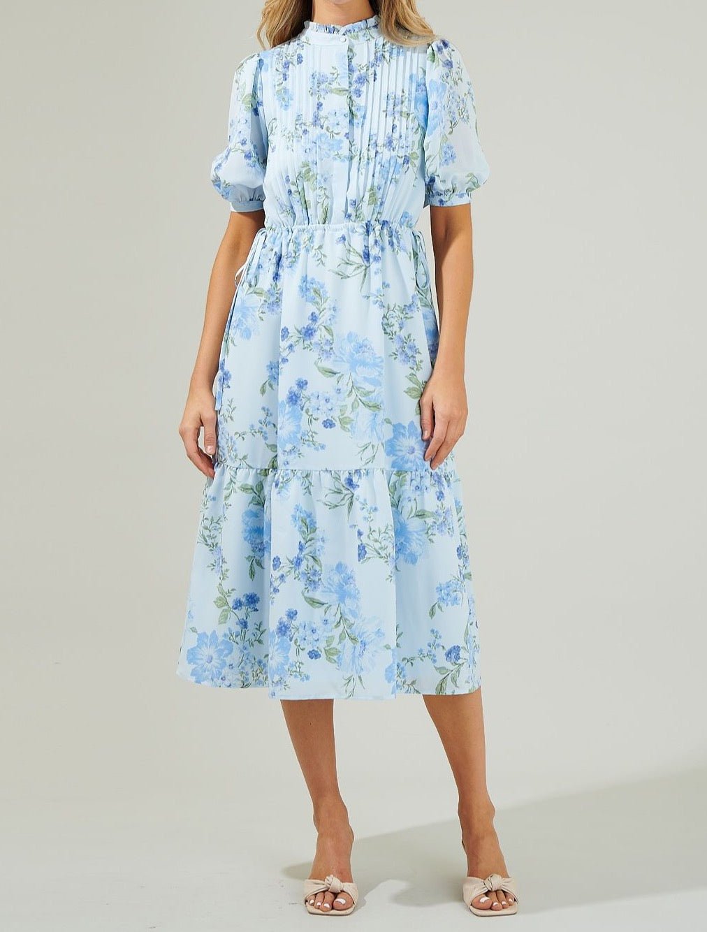 Light blue floral pleated midi dress with puff sleeves front view