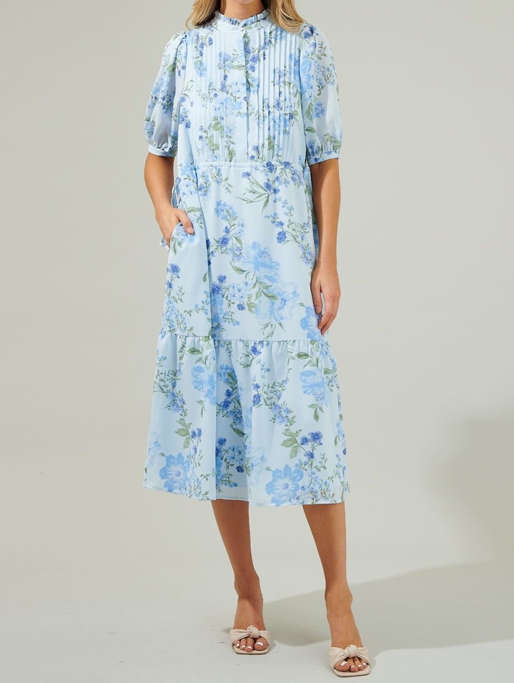 Light blue floral pleated midi dress with adjustable waist and feminine shape