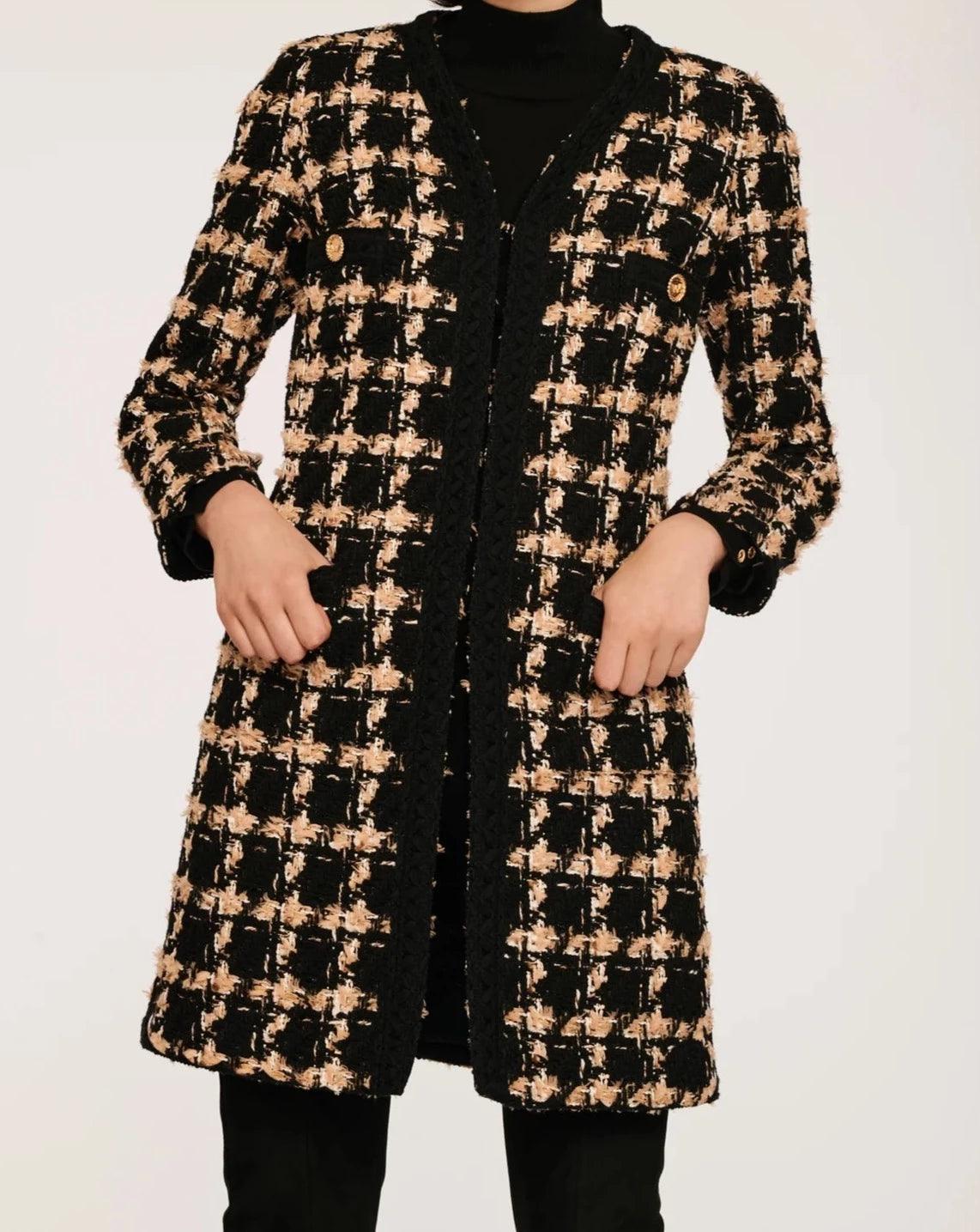 Close-up of longline black and beige check tweed jacket with braid trim and gold-tone buttons by Weill Paris