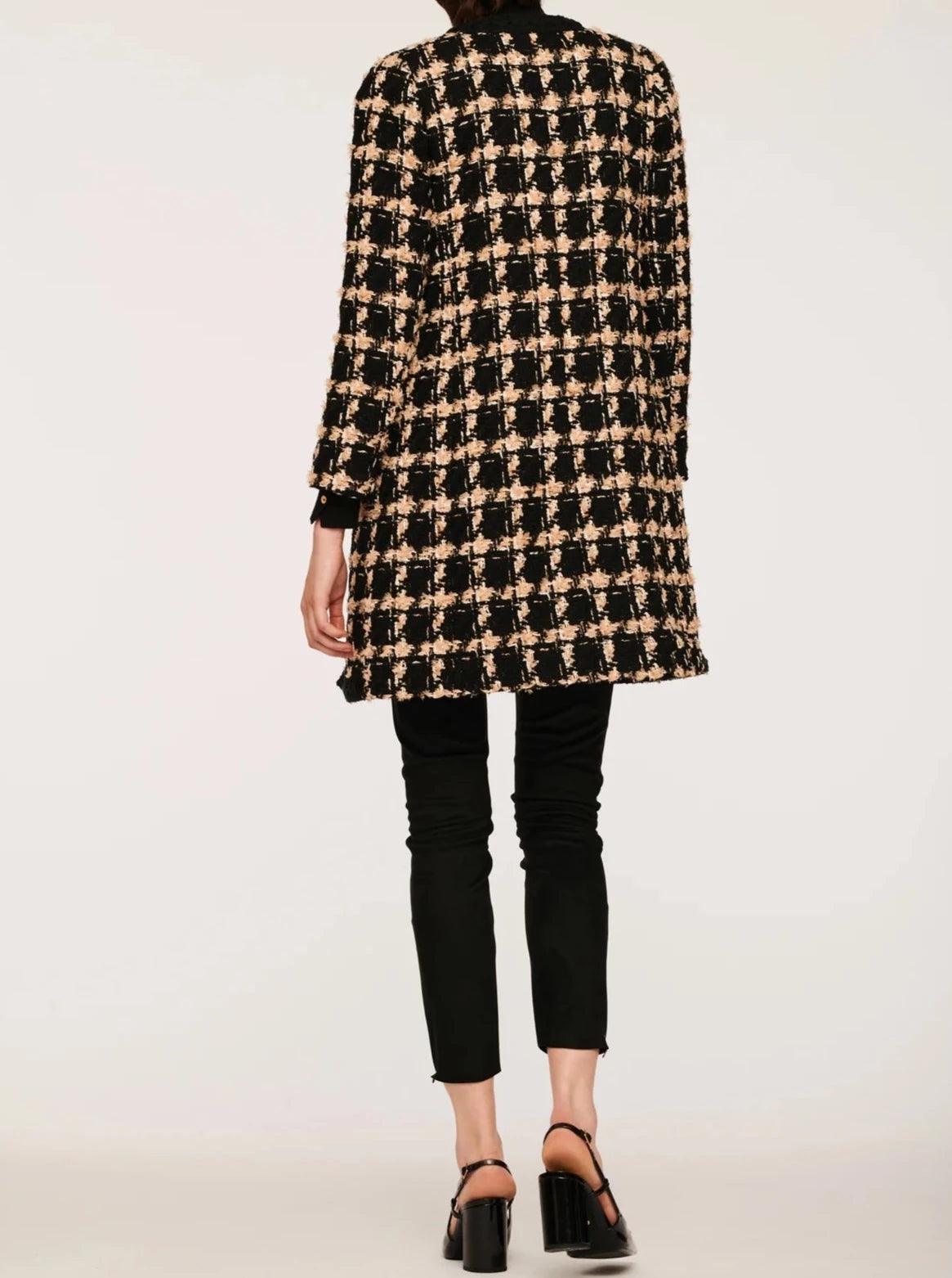 Full back view of women’s black and beige check tweed jacket in a straight longline silhouette