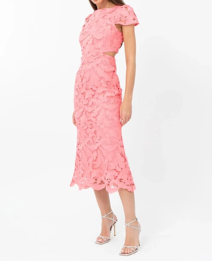 Angled view of Portia bubblegum pink occasion dress with round neckline and textured floral lace