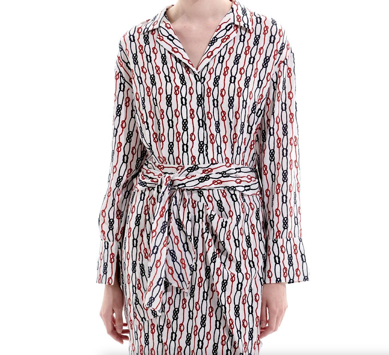 Close-up of adjustable self-tie belt on silk chain print dress